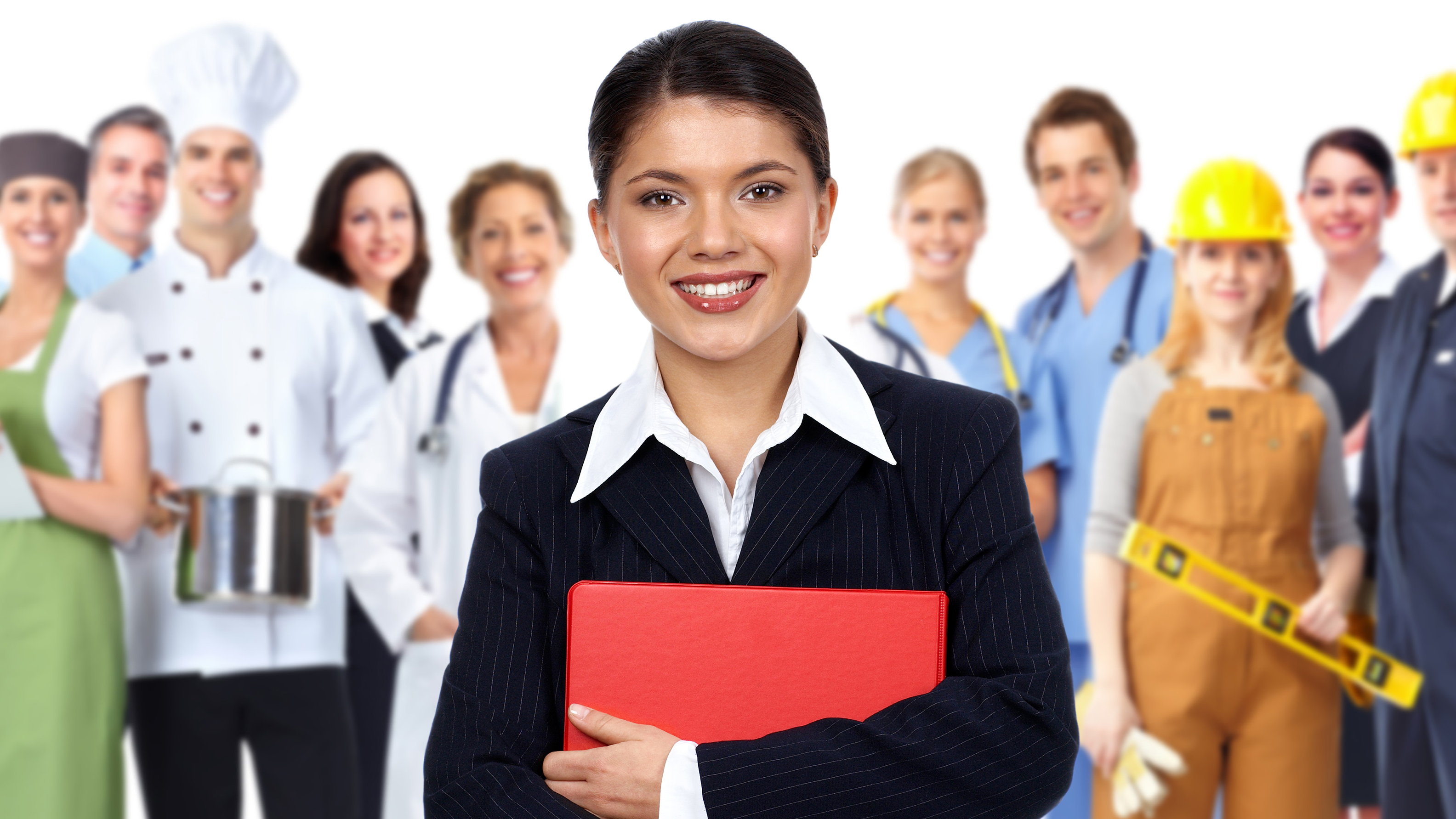 Young business woman standing in front of a group of young people from various Job Corps career paths