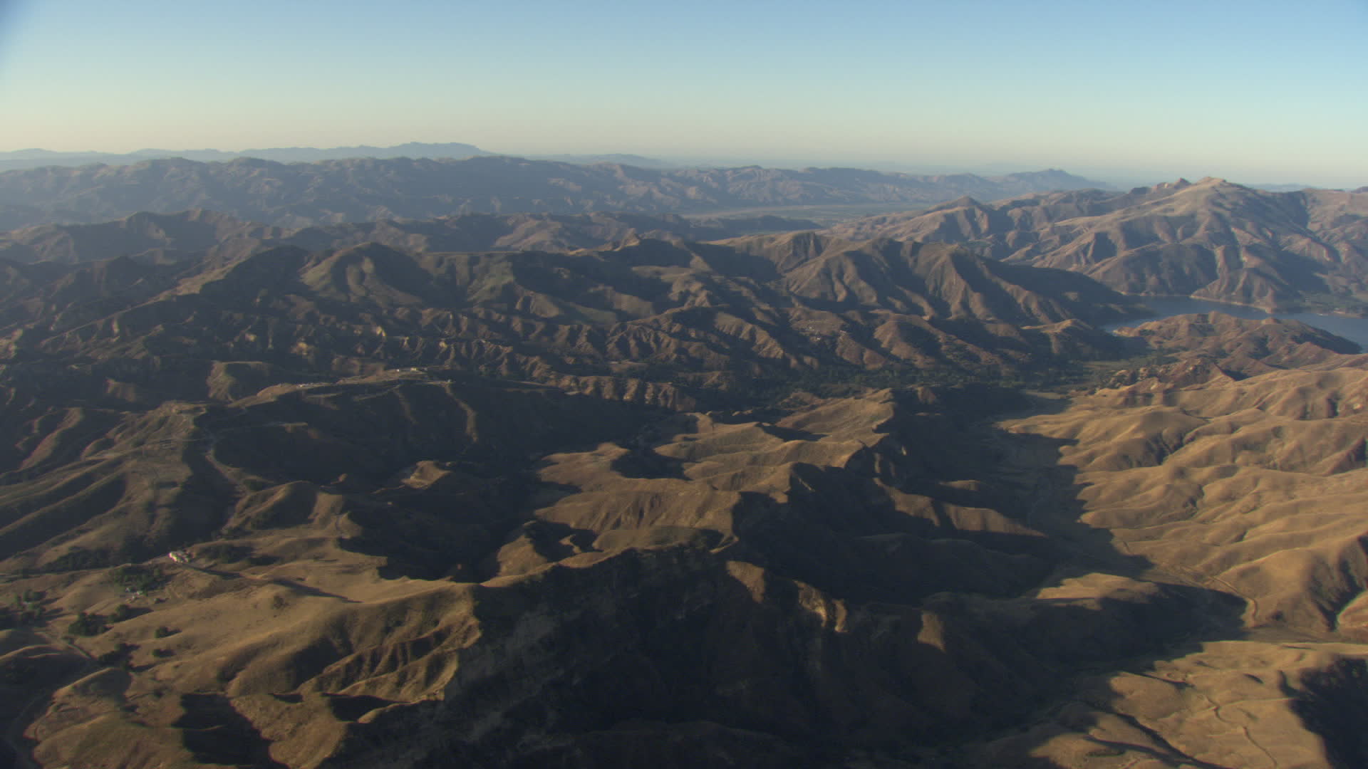 HD stock footage aerial video of flying by mountains revealing Quail Lake, Transverse Ranges