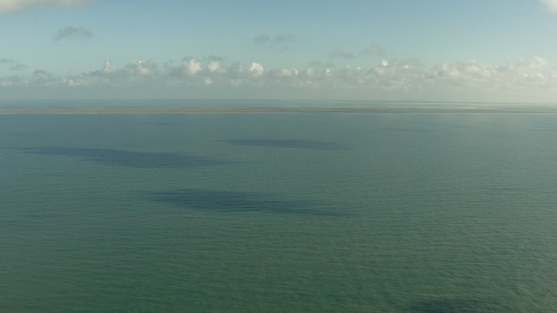 HD stock footage aerial video fly over the Gulf of Mexico to approach