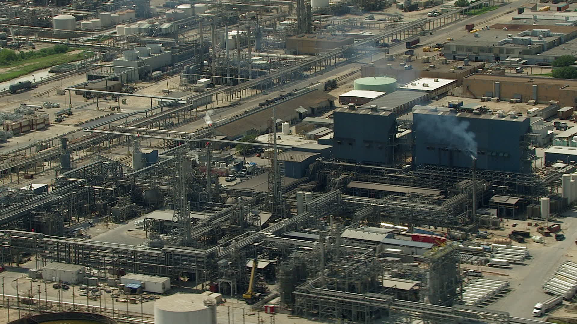 HD stock footage aerial video oil refinery buildings and structures in