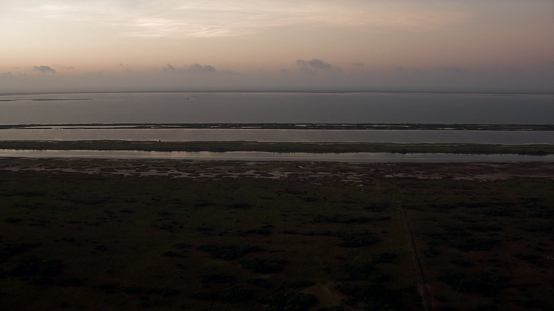 HD stock footage aerial video of flying over wetlands to approach Espiritu Santo Bay, Texas