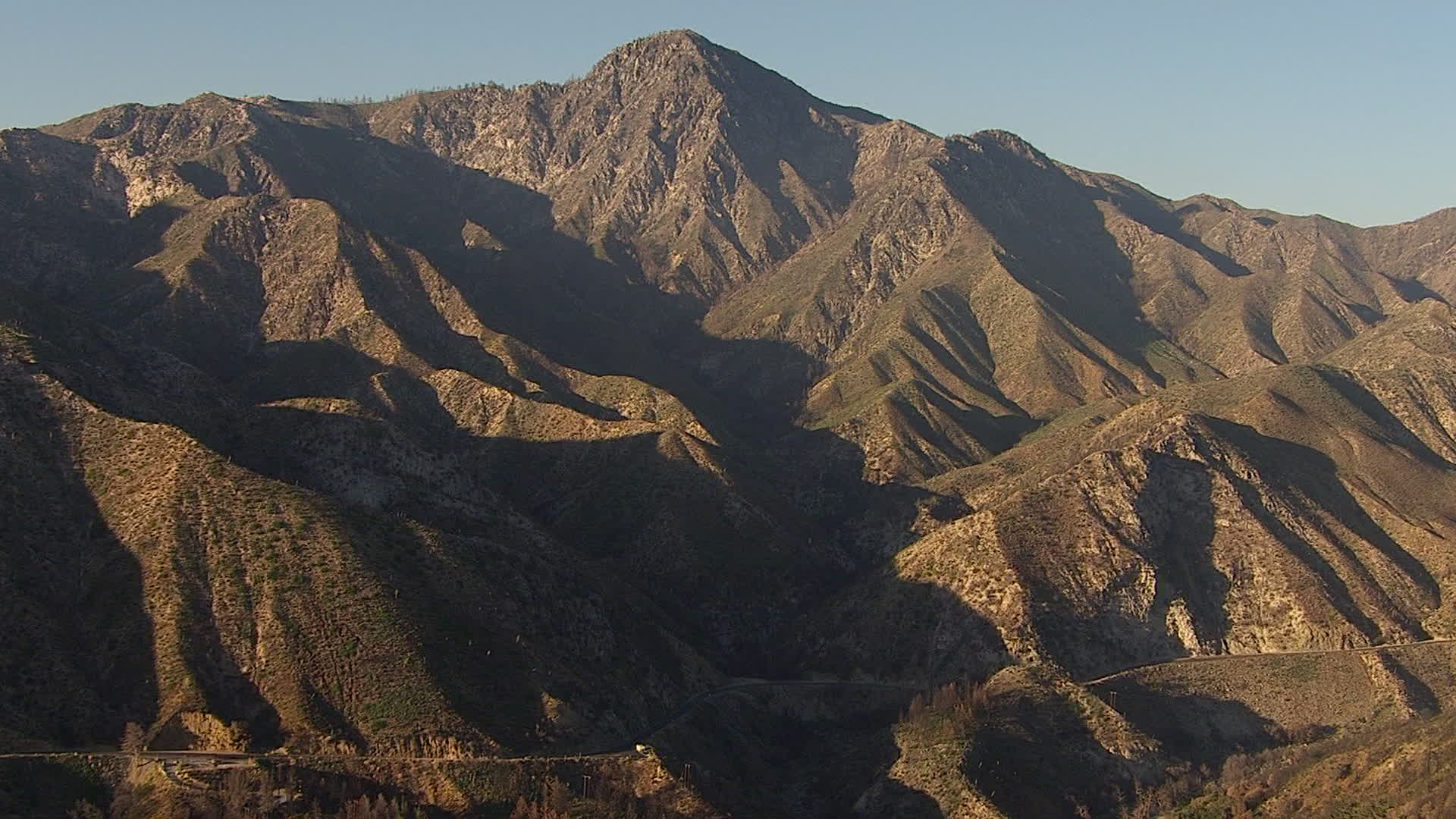 HD stock footage aerial video approach a rugged peak in the San Gabriel