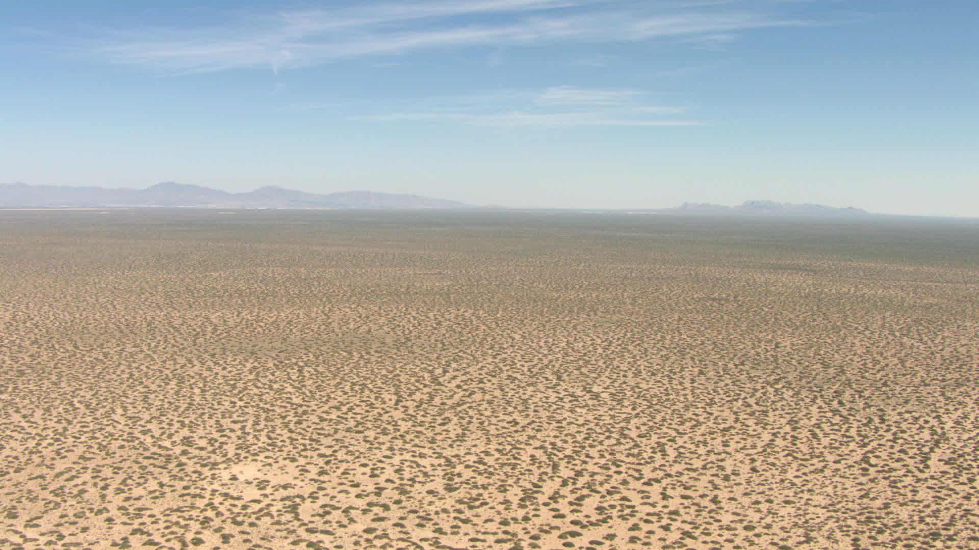 HD stock footage aerial video of flying over a dry desert plain in New