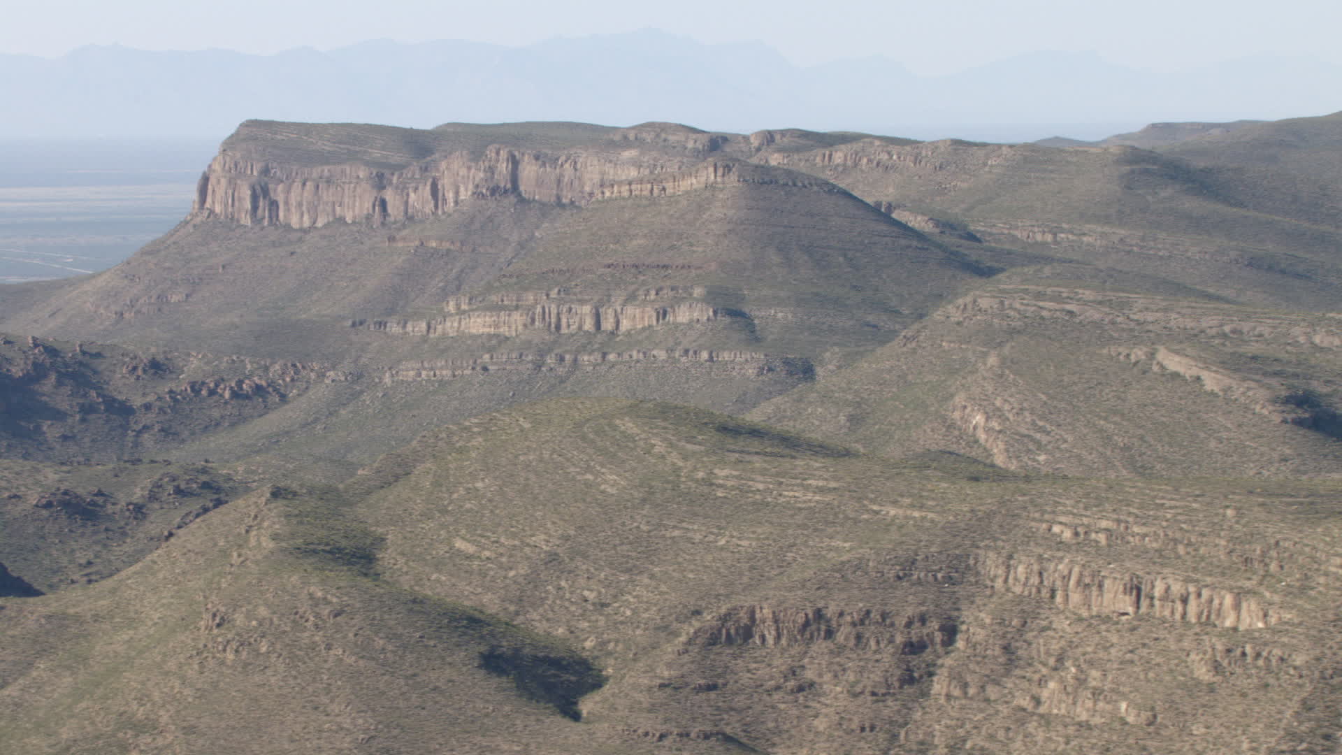 HD stock footage aerial video of passing a barren mountain range near