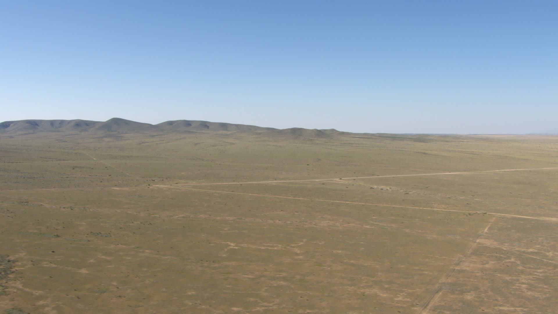 HD stock footage aerial video of a desert plain and hills near El Paso