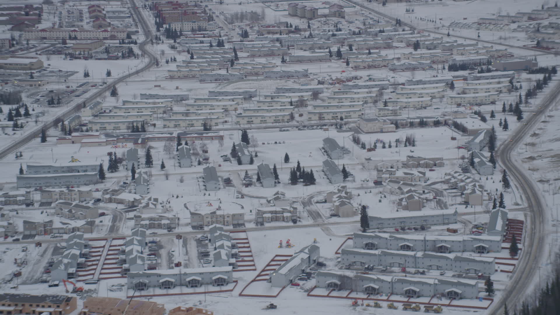 4K stock footage aerial video approaching snow covered neighborhoods in