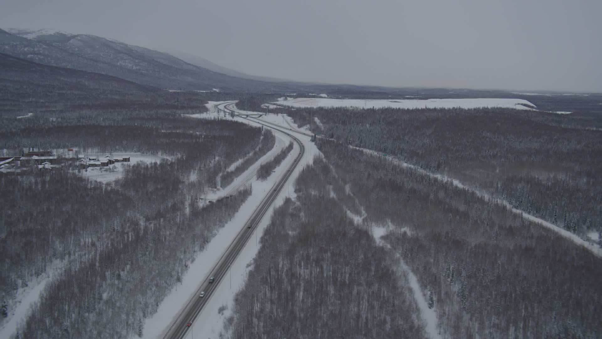 4K stock footage aerial video snowy Glenn Highway stretching toward
