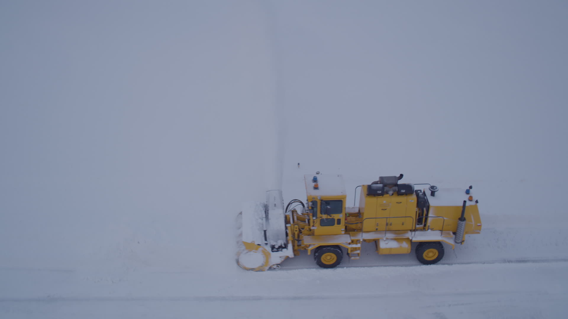 4K stock footage aerial video flying by a snow plow clearing Merrill