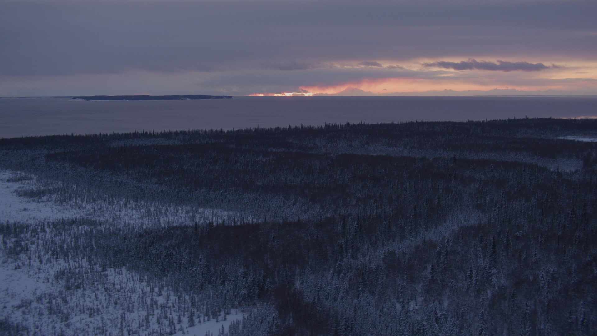 4K stock footage aerial video twilight lit clouds seen from snow