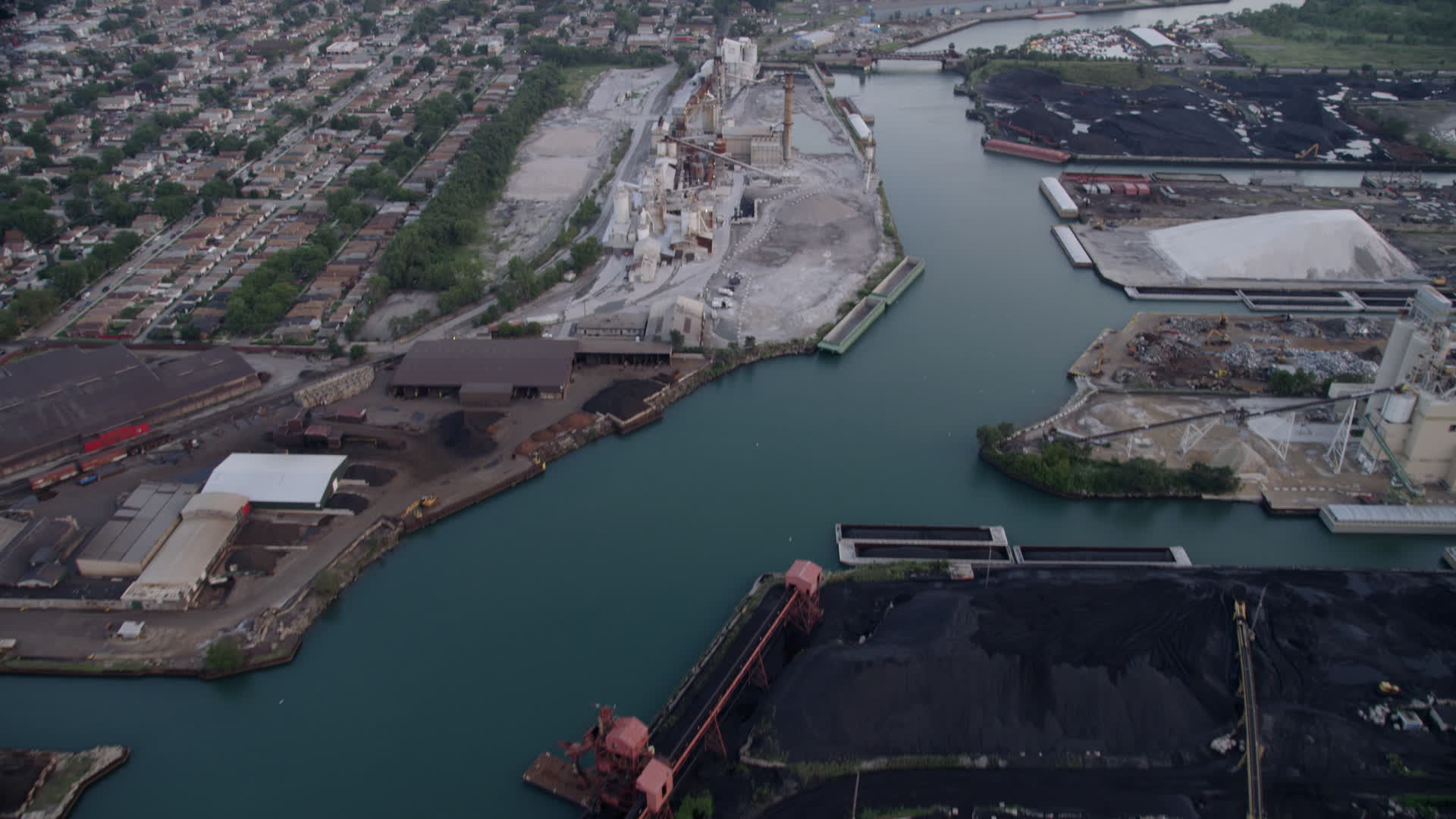 4.8K stock footage aerial video tilt from piles of petroleum coke by the Calumet River to reveal