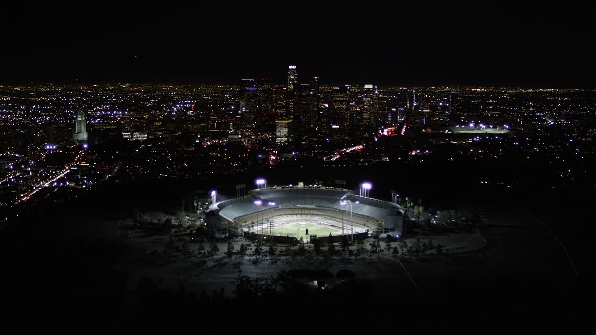 5K stock footage aerial video fly over Dodger Stadium to approach