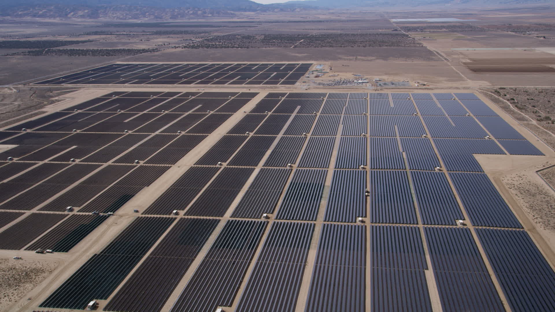 5K stock footage aerial video approach and fly over Mojave Desert solar