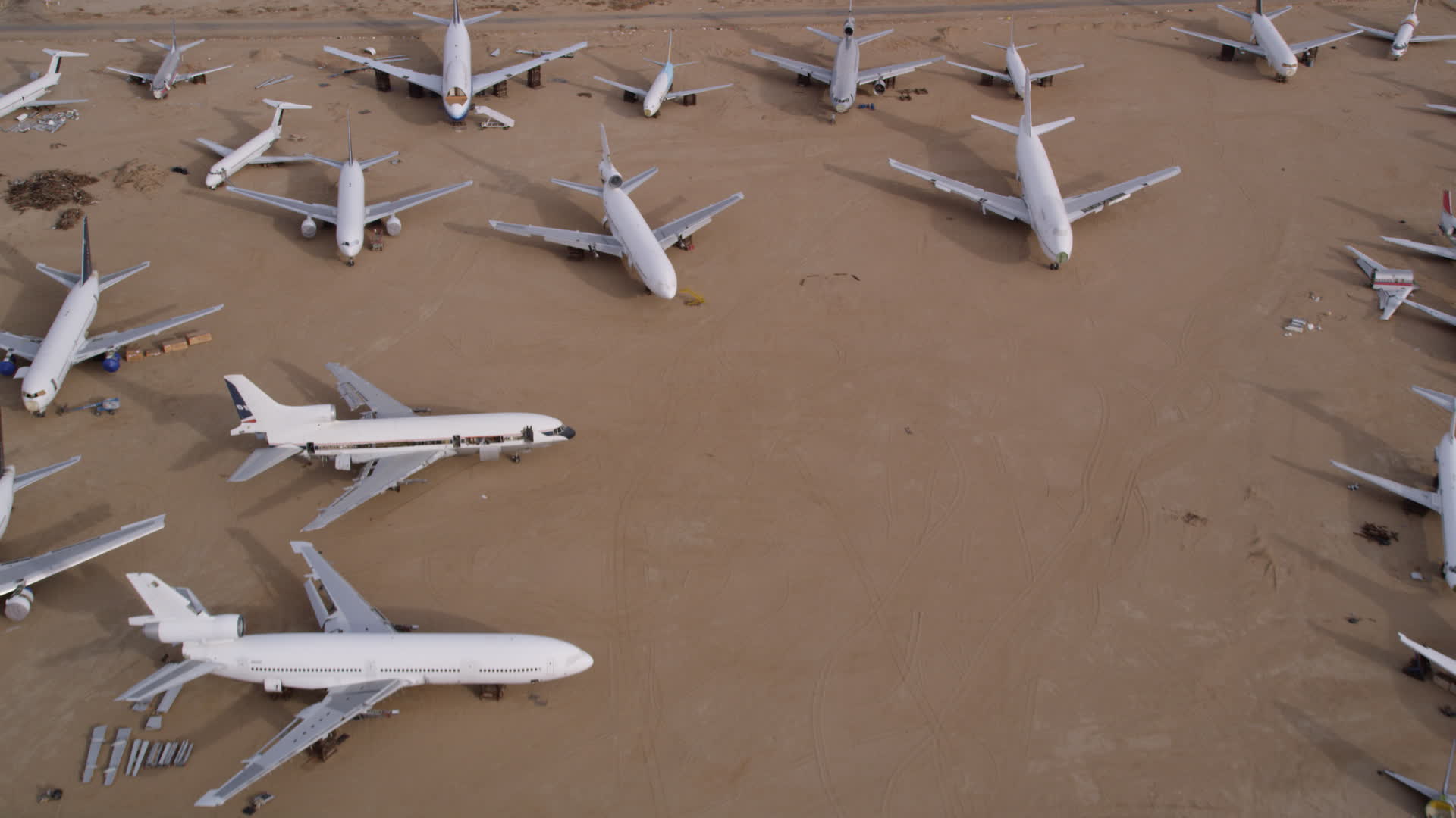 5K stock footage aerial video flying over jets at an aircraft boneyard