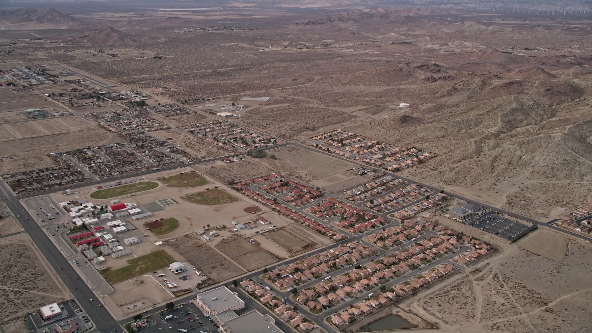 5K stock footage aerial video of small desert neighborhoods in Rosamond