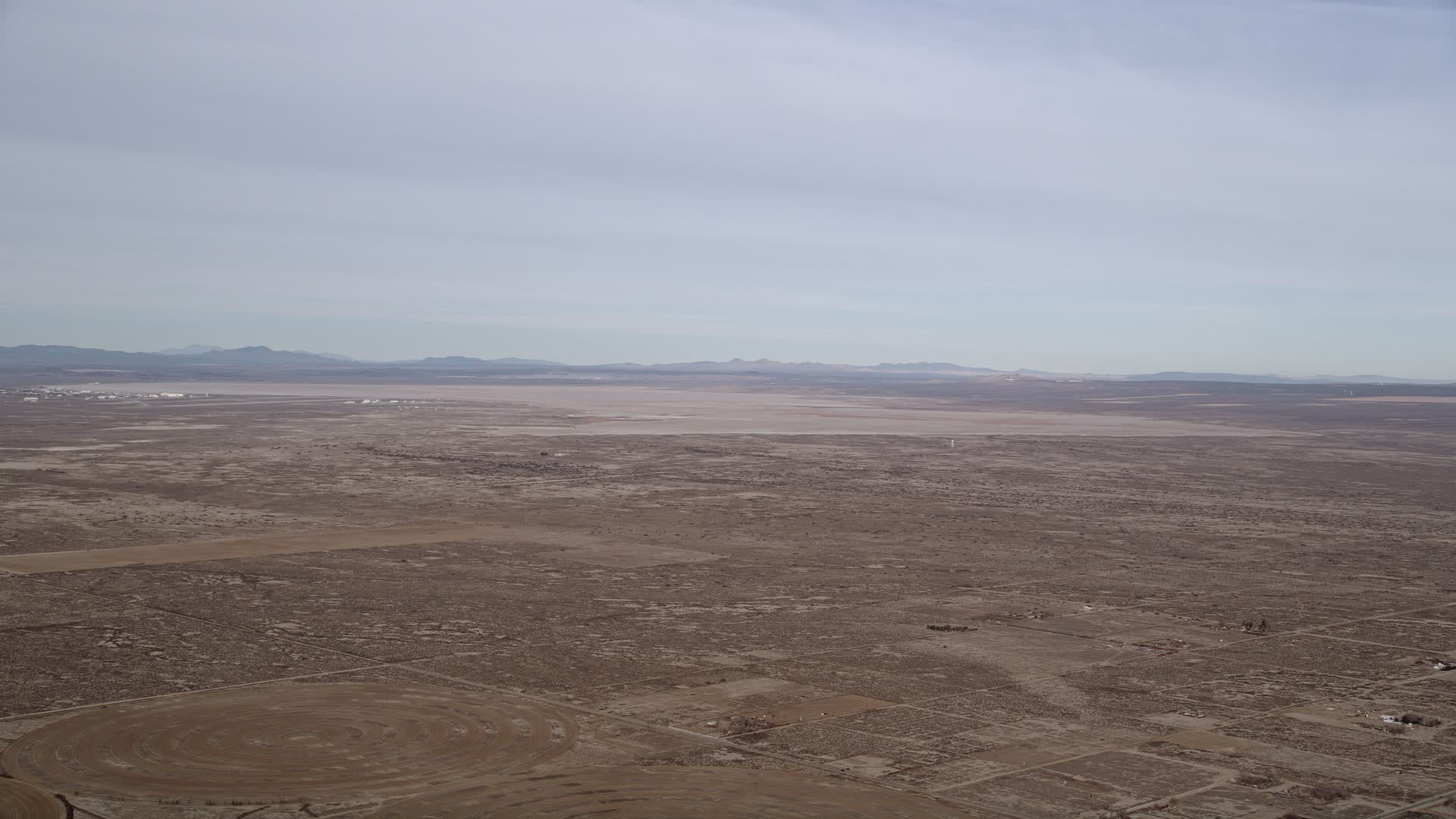 5K stock footage aerial video of Edward Air Force Base and dry lake in