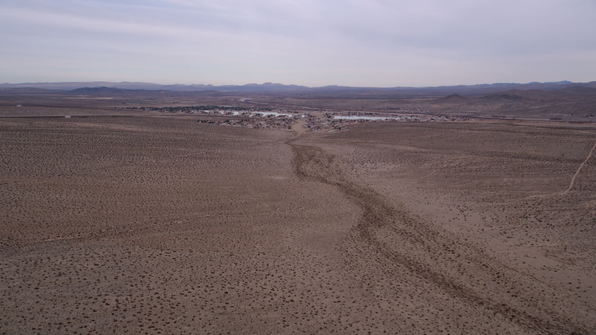 5K stock footage aerial video approach the small desert town of