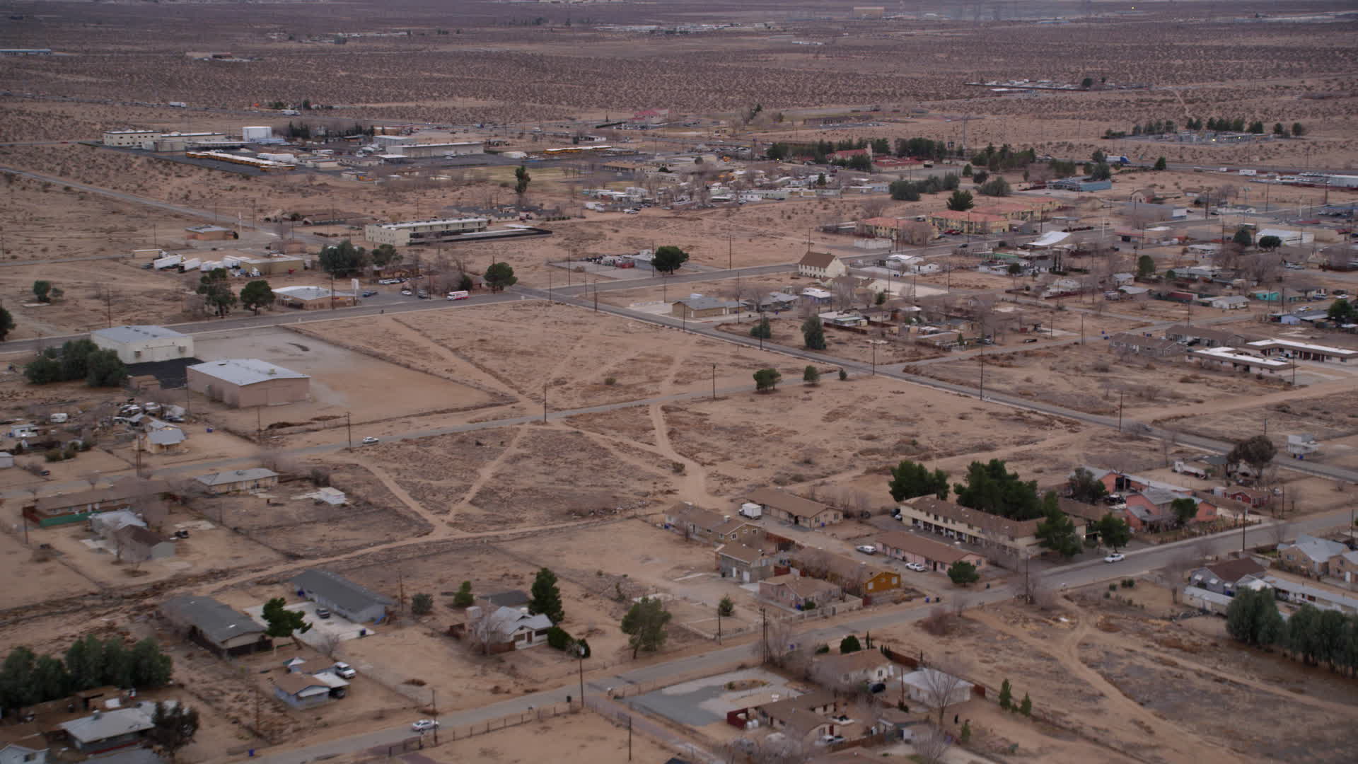 5K stock footage aerial video fly over rural homes in the small desert