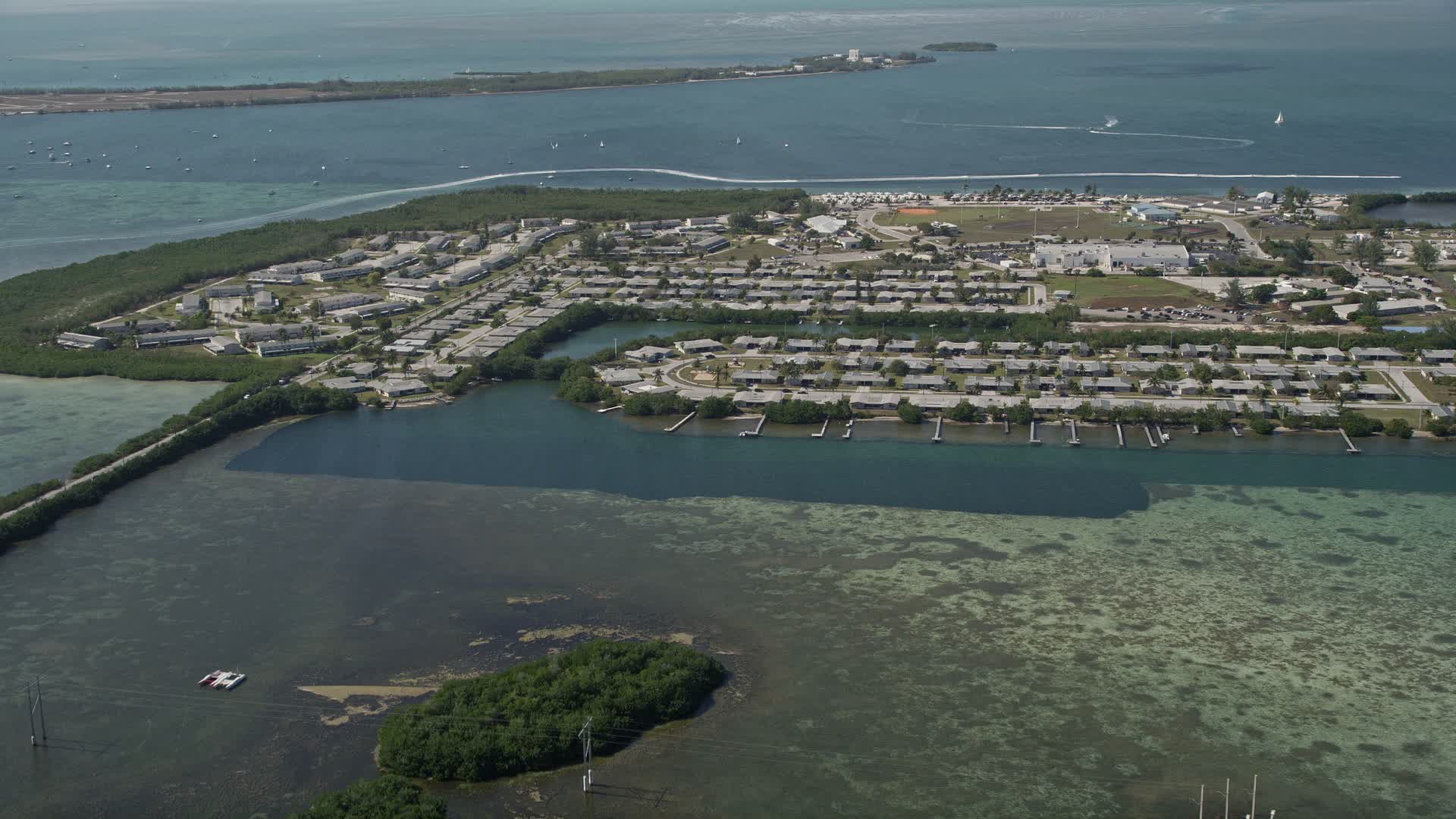 5K stock footage aerial video of approaching military housing on Sigsbee Park shore, Key West