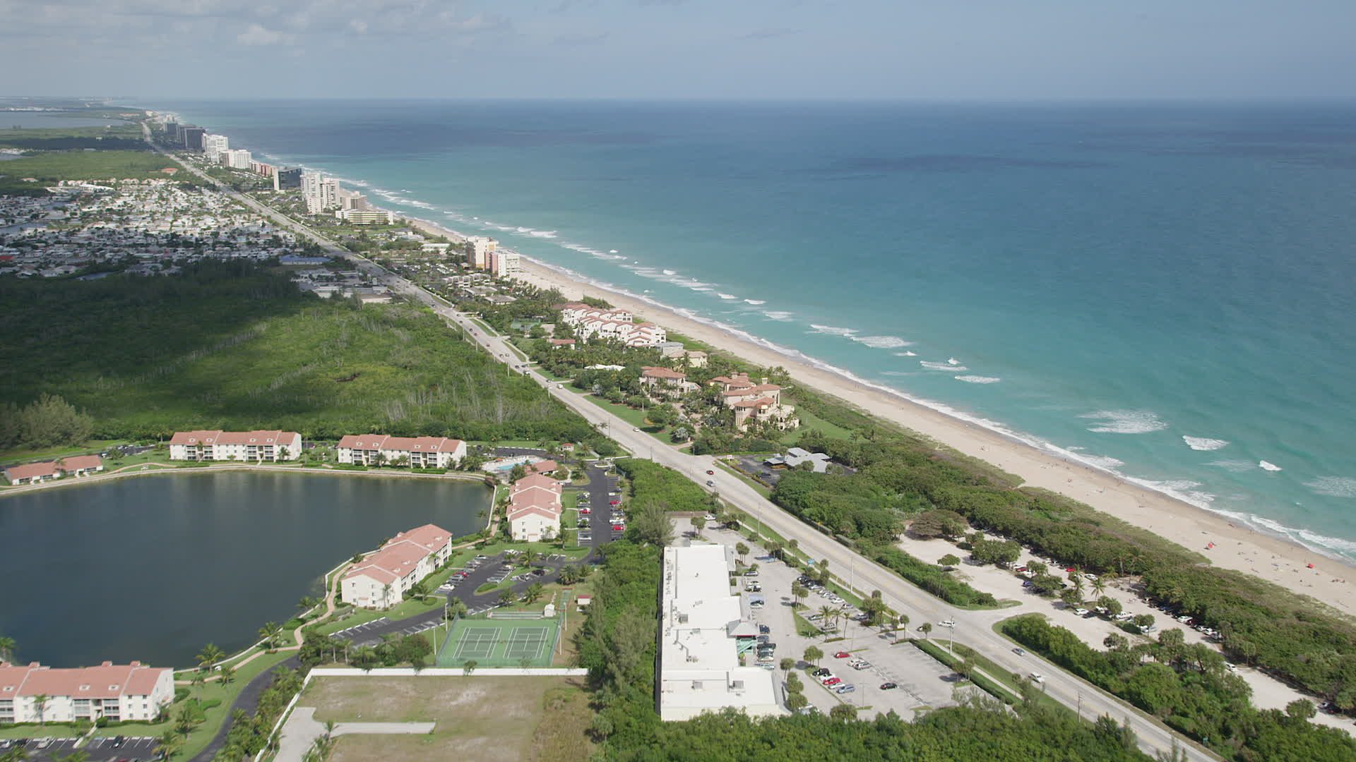 5K stock footage aerial video fly by condominium complexes toward the