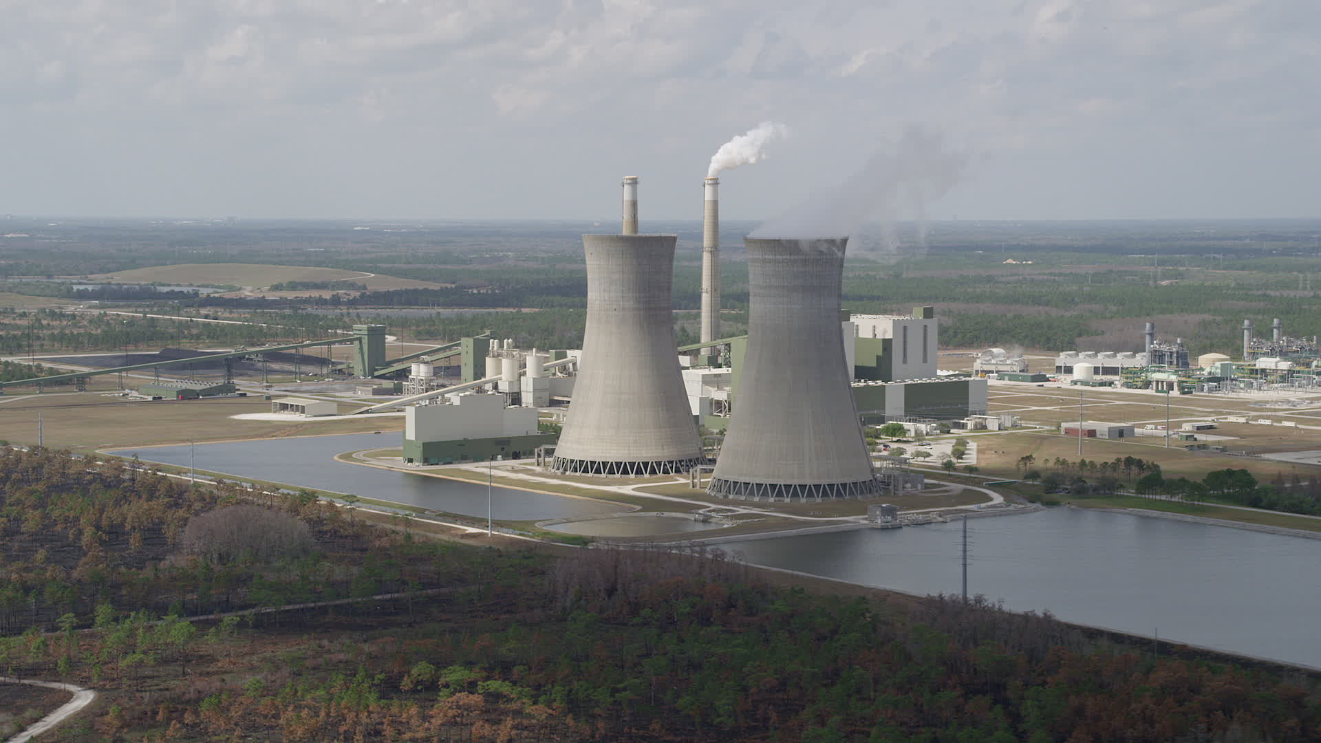 5K stock footage aerial video of flying by a coal fired