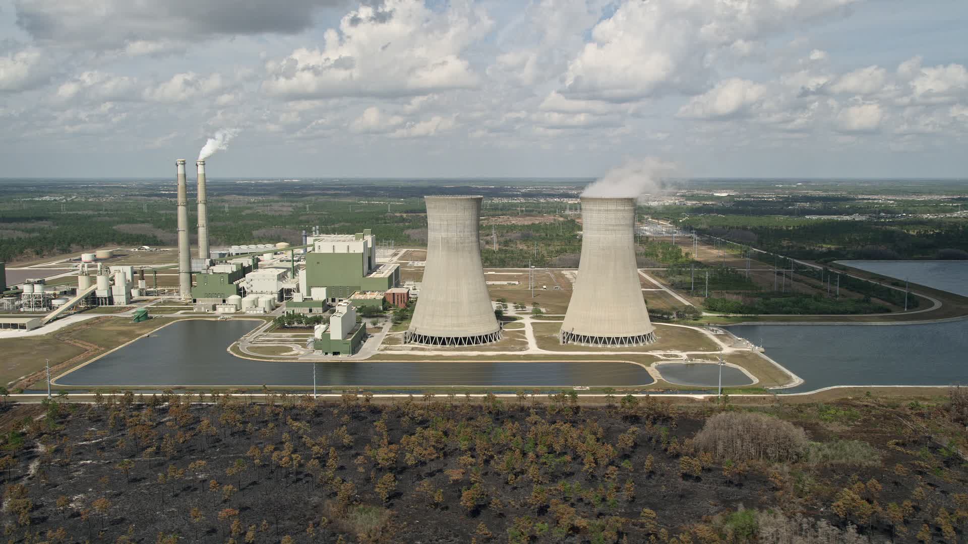 5K stock footage aerial video of flying by a coal fired