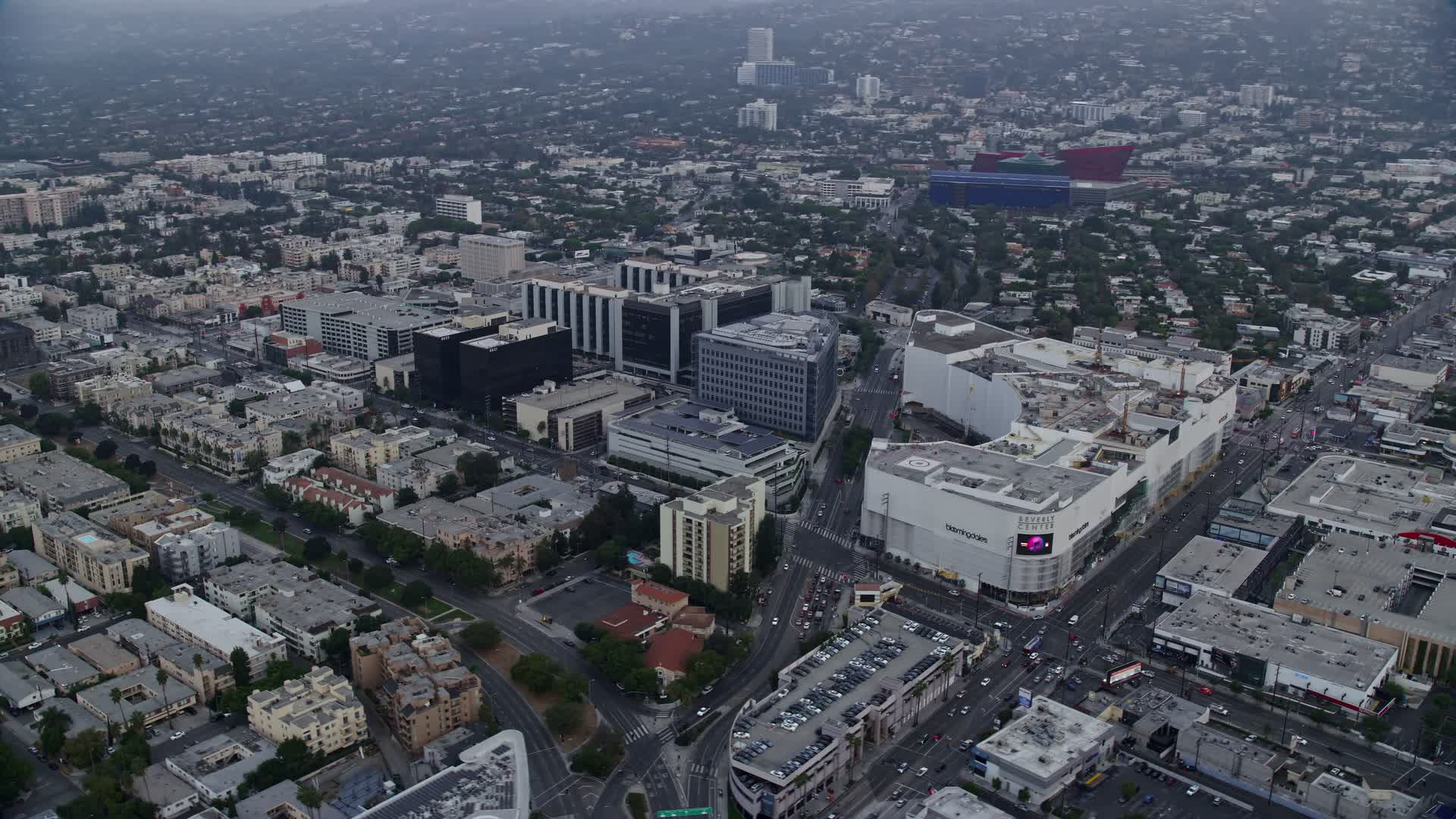 8K stock footage aerial video circling around Beverly Center and Cedars