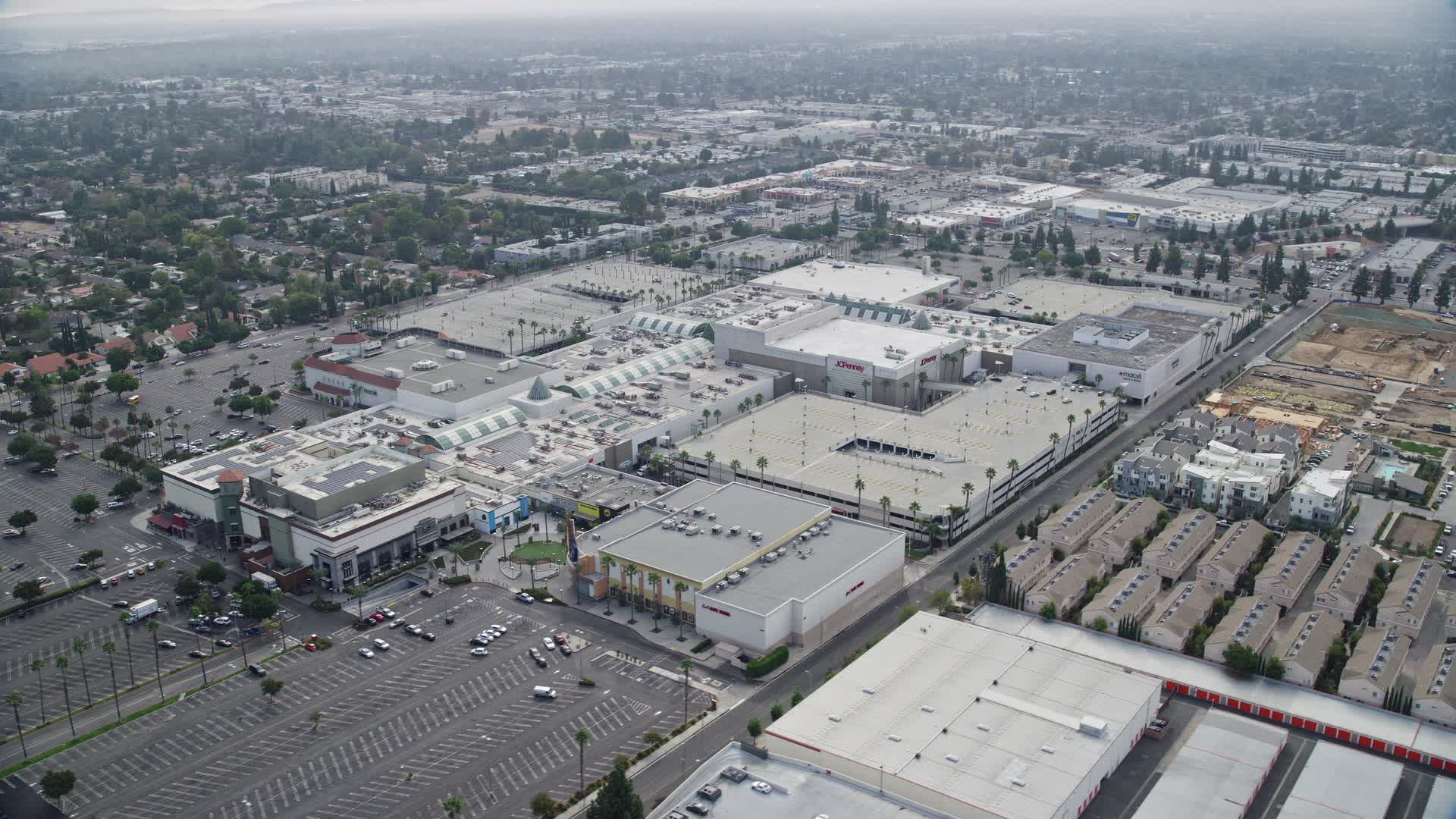 8K stock footage aerial video of Northridge Shopping Mall with few