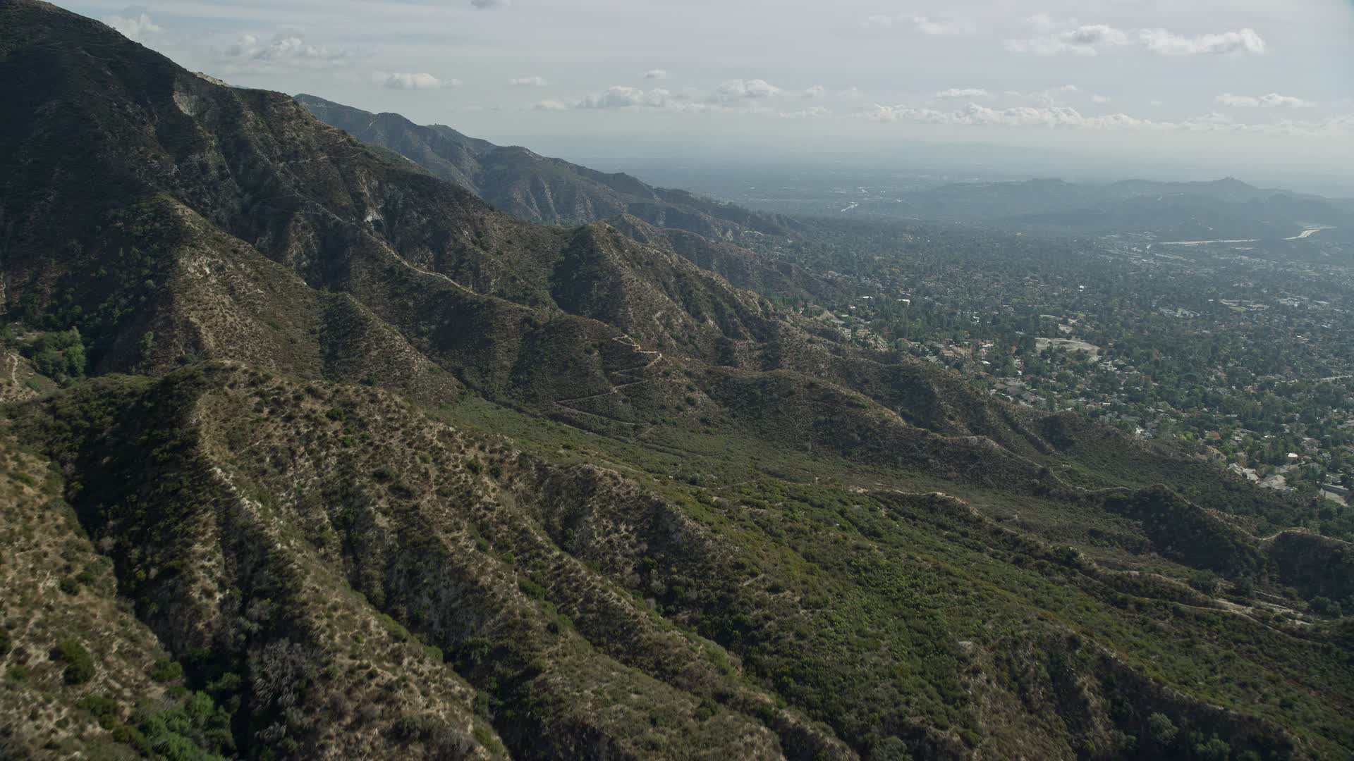 7.6K stock footage aerial video flying over mountain ridges, La
