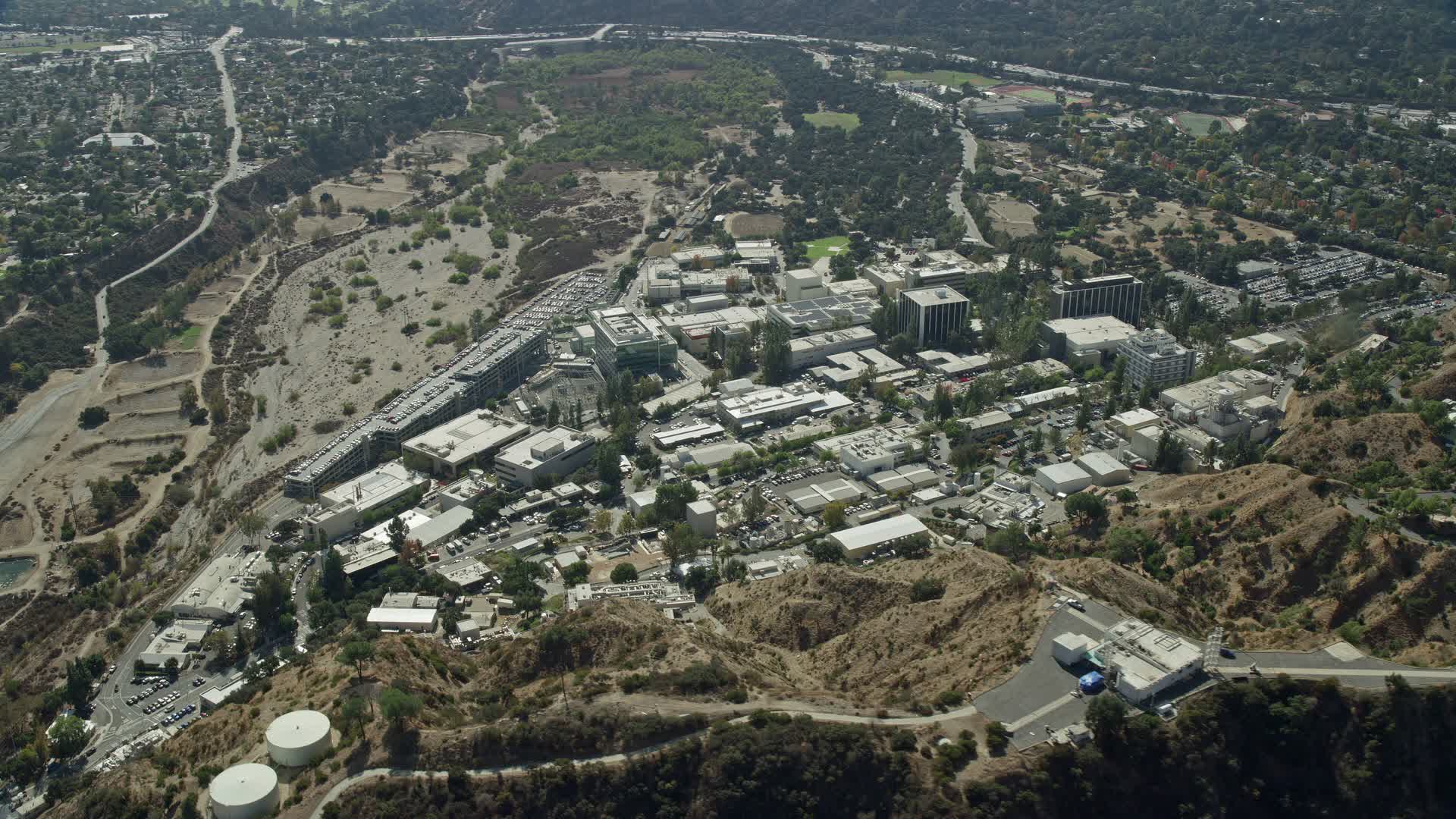 7.6K stock footage aerial video approaching Jet Propulsion Laboratory