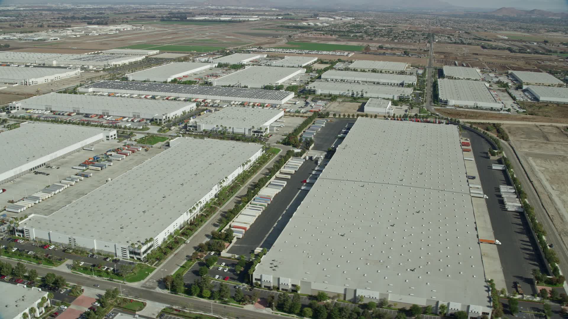 7.6K stock footage aerial video of several warehouses in Chino