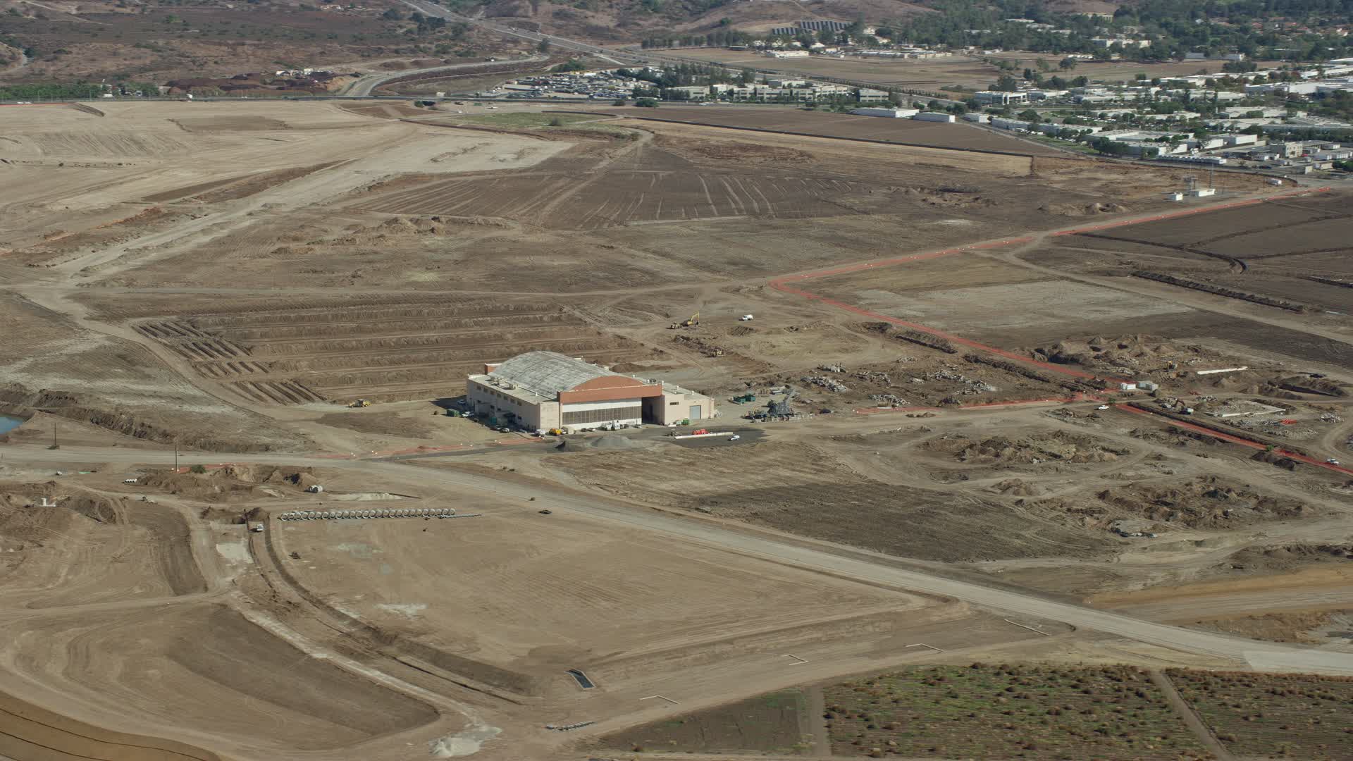 7.6K stock footage aerial video of a hangar at an abandoned military