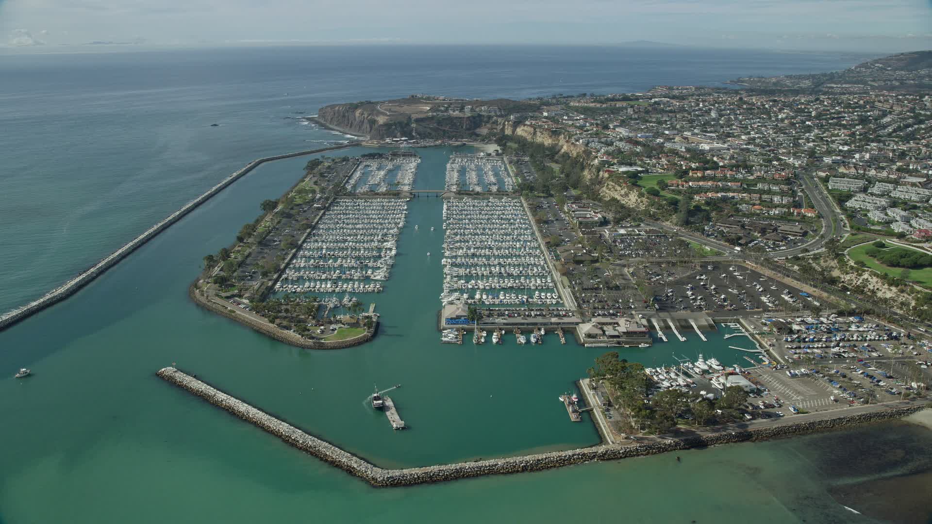 7.6K stock footage aerial video of breakwaters around Dana Point Harbor