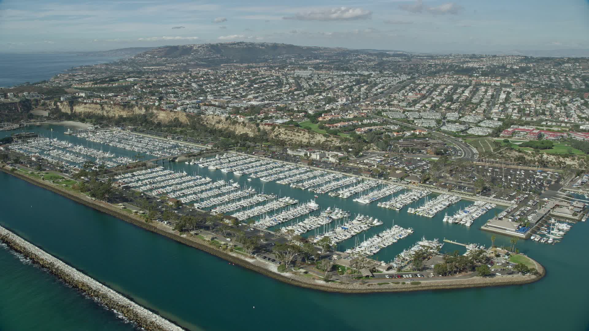 7.6K stock footage aerial video of Dana Point Harbor and seaside