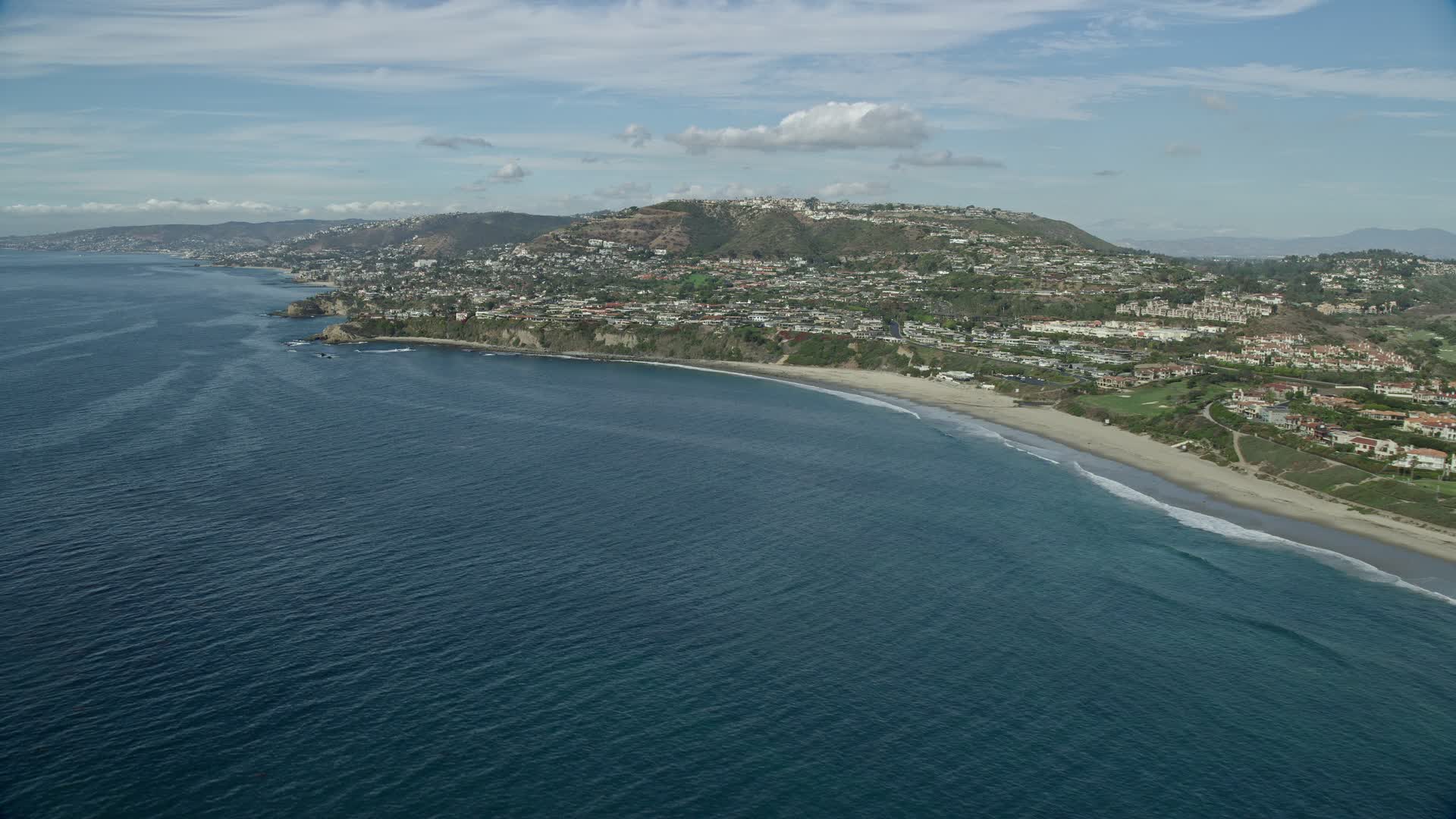 7.6K stock footage aerial video flying by homes overlooking the ocean