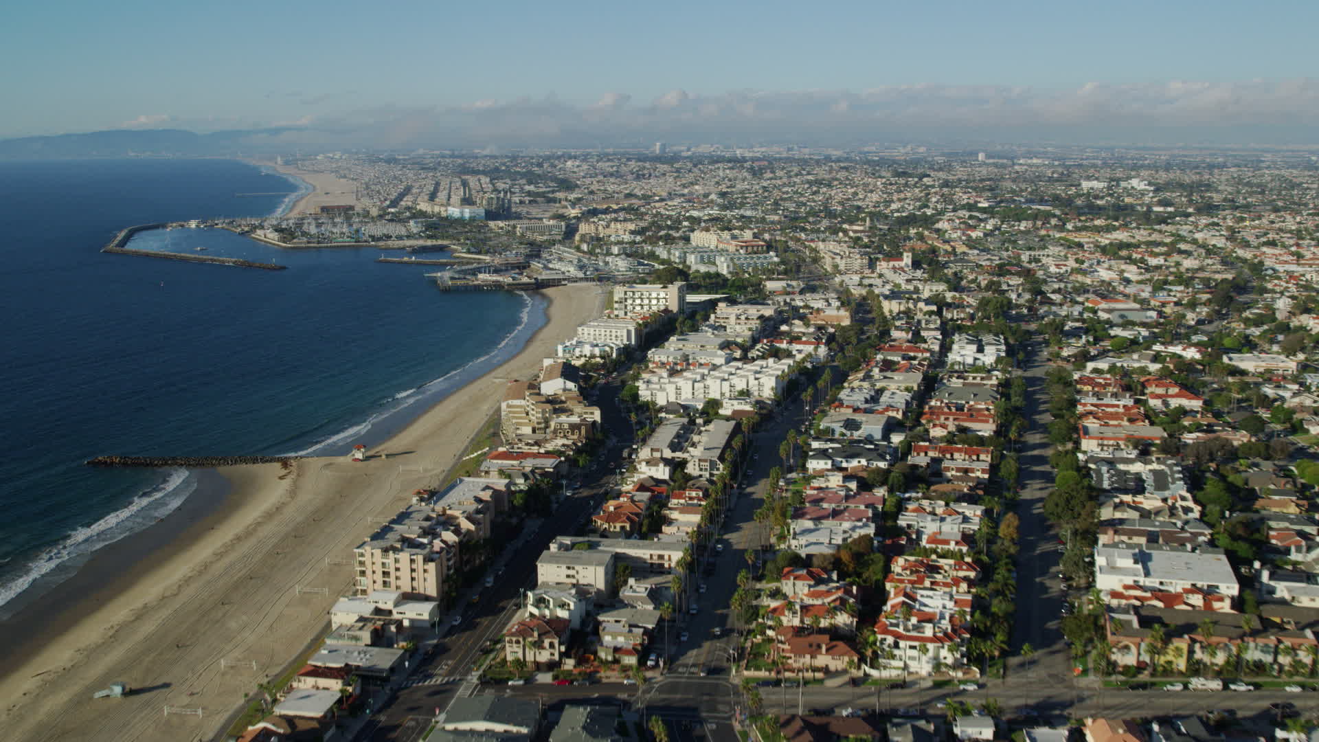 7.6K stock footage aerial video flying over Torrance Beach and pan