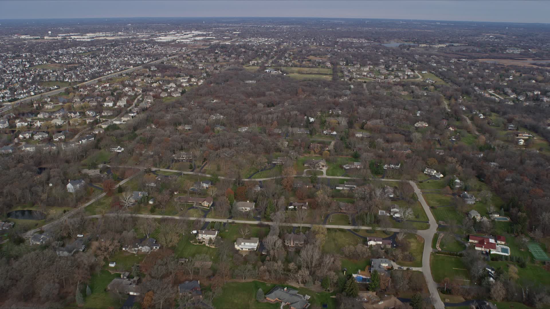 4K stock footage aerial video of flying over a quiet suburban