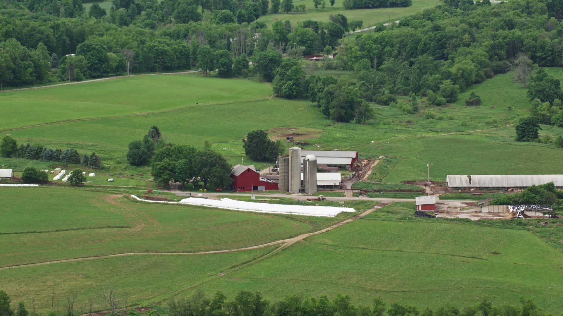 4.8K stock footage aerial video of a red barn and silos in Enon Valley