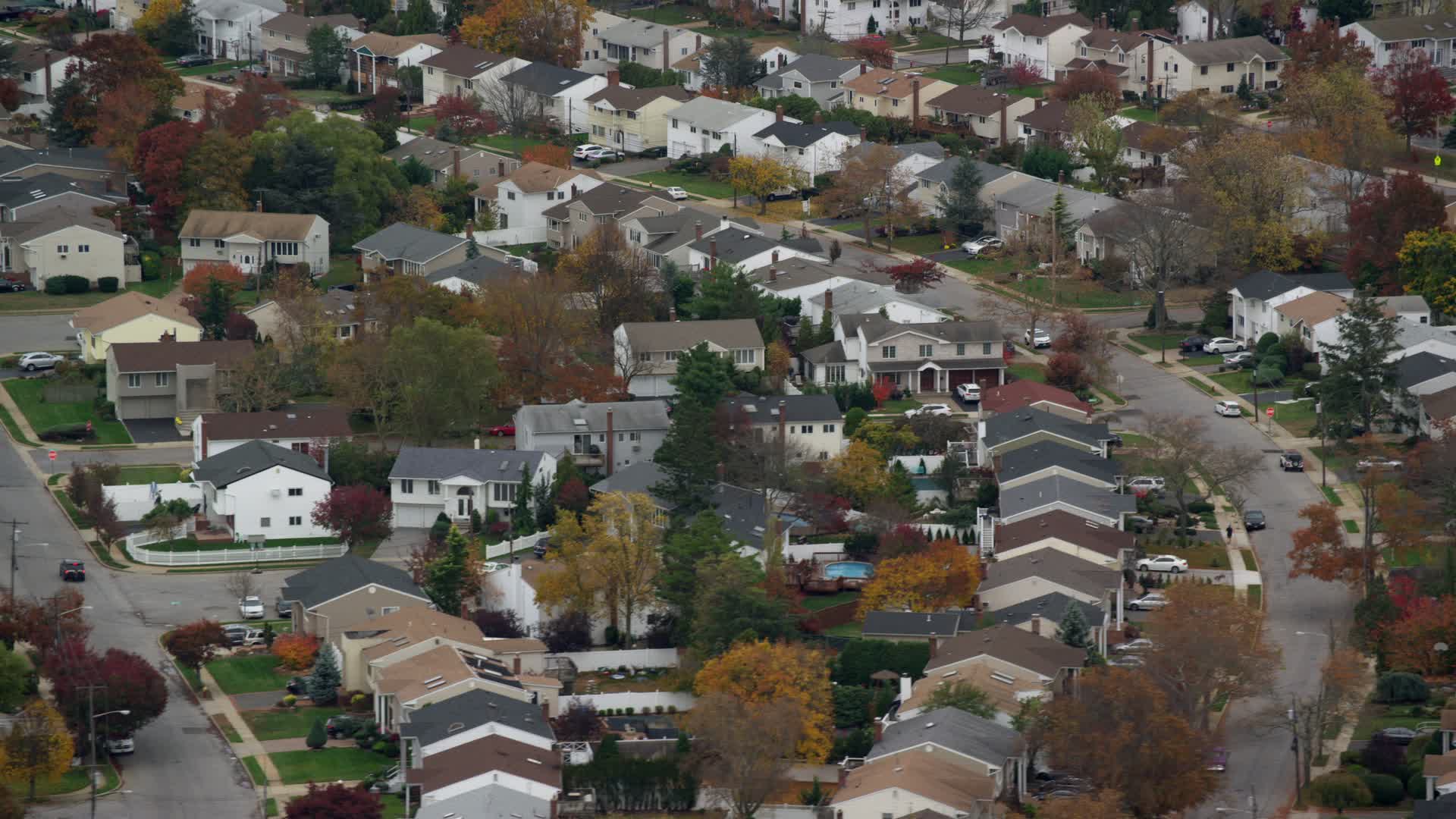 6K stock footage aerial video of passing suburban homes in Autumn