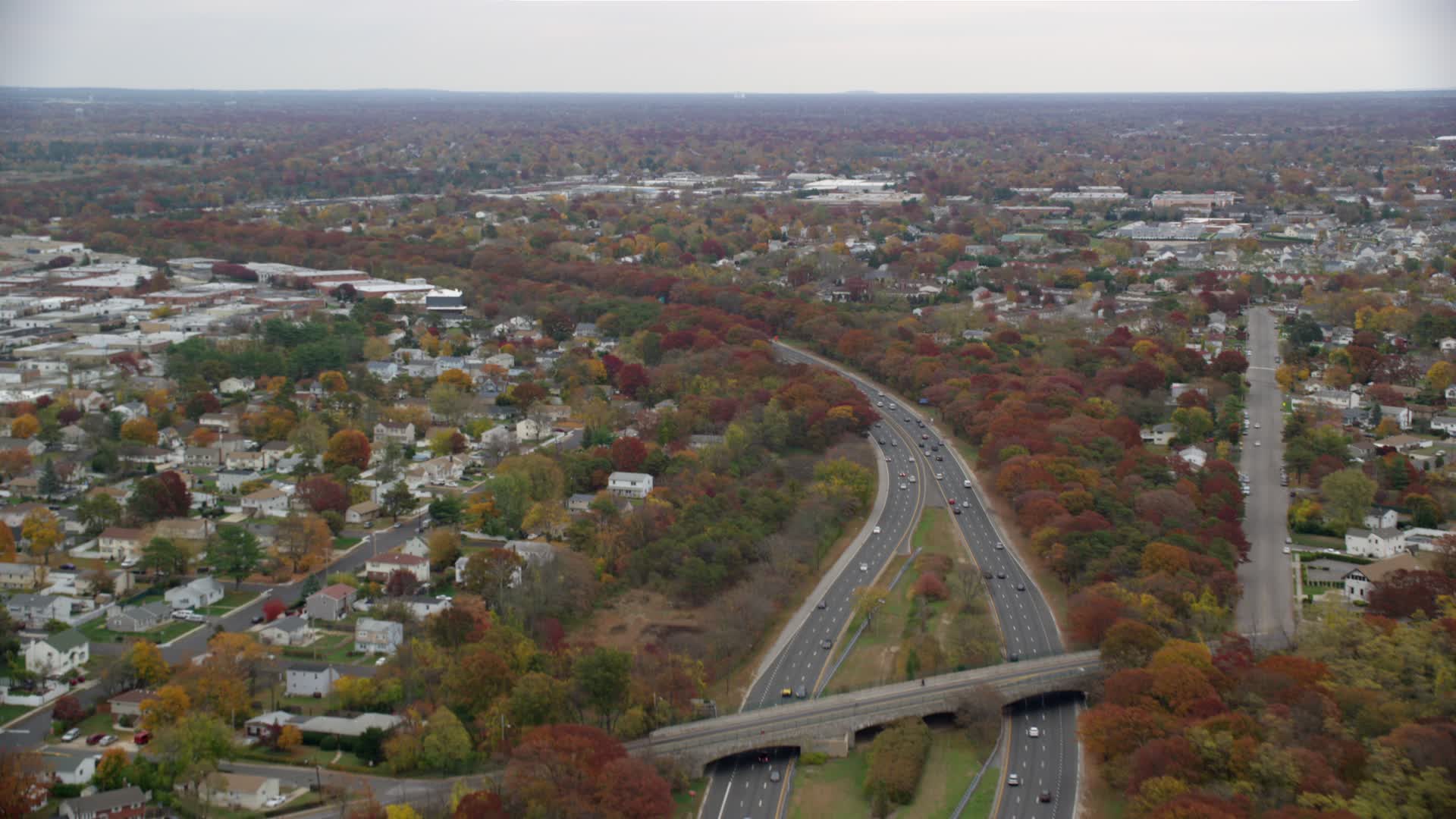 6K stock footage aerial video tilt from freeway with light traffic to