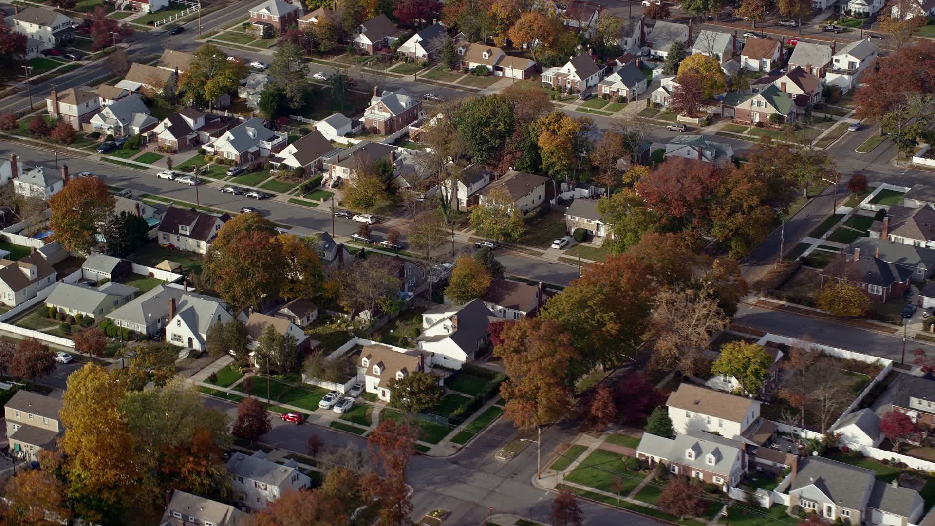 6K stock footage aerial video of blocks of suburban homes in Autumn