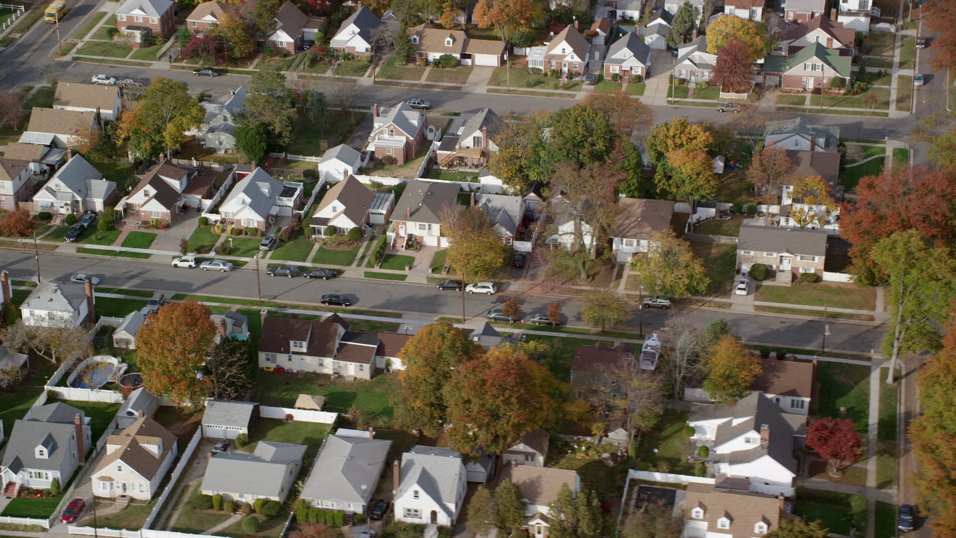 6K stock footage aerial video of an orbit of suburban homes in Autumn