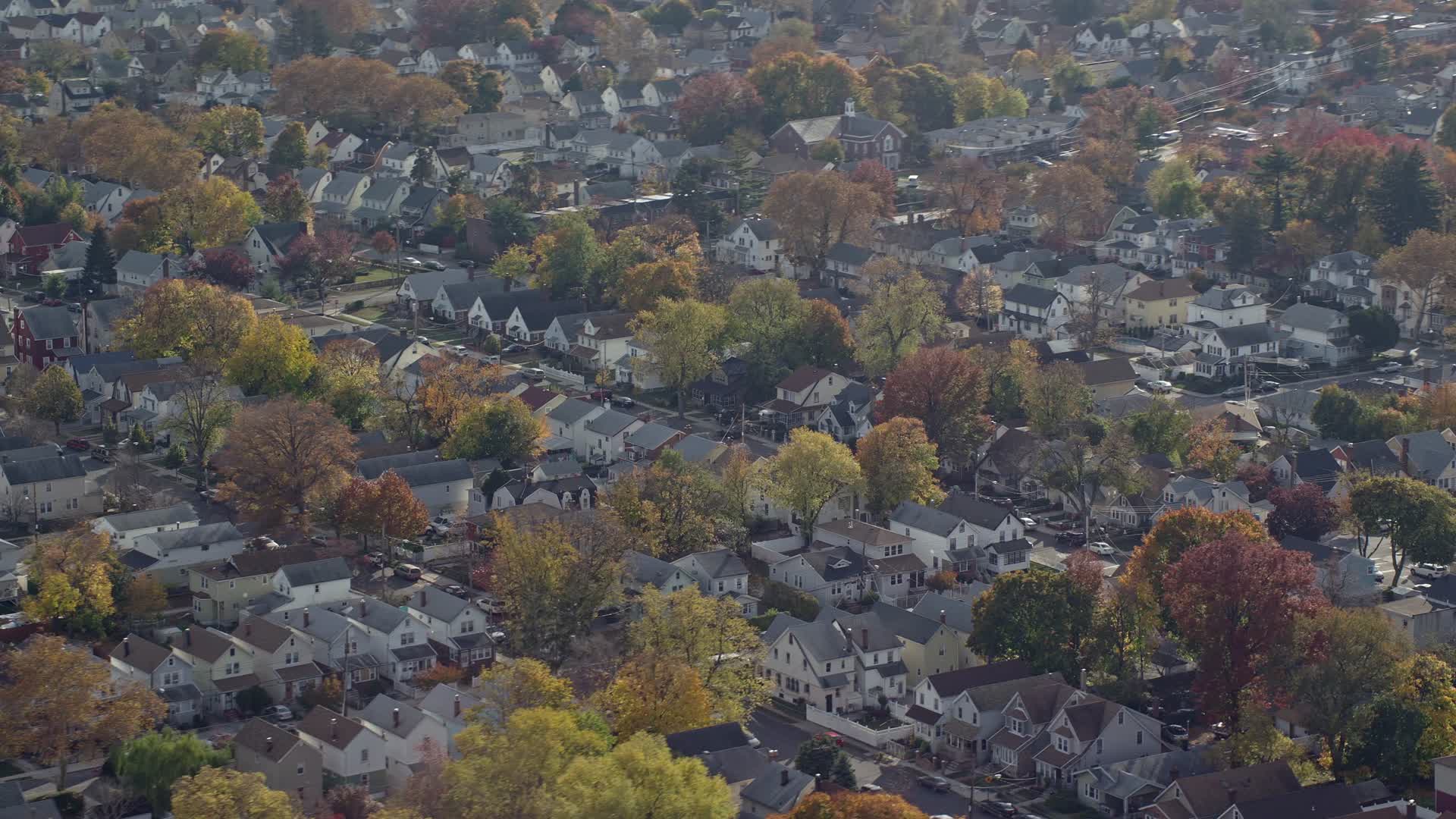5.5K stock footage aerial video of suburban tract homes in Autumn