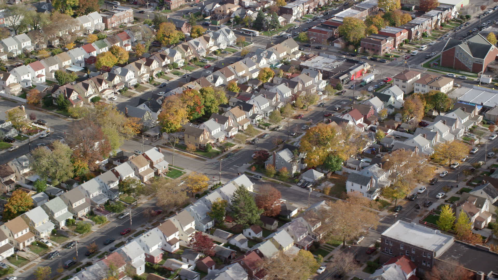 6K stock footage aerial video orbit tract homes in Autumn, Queens