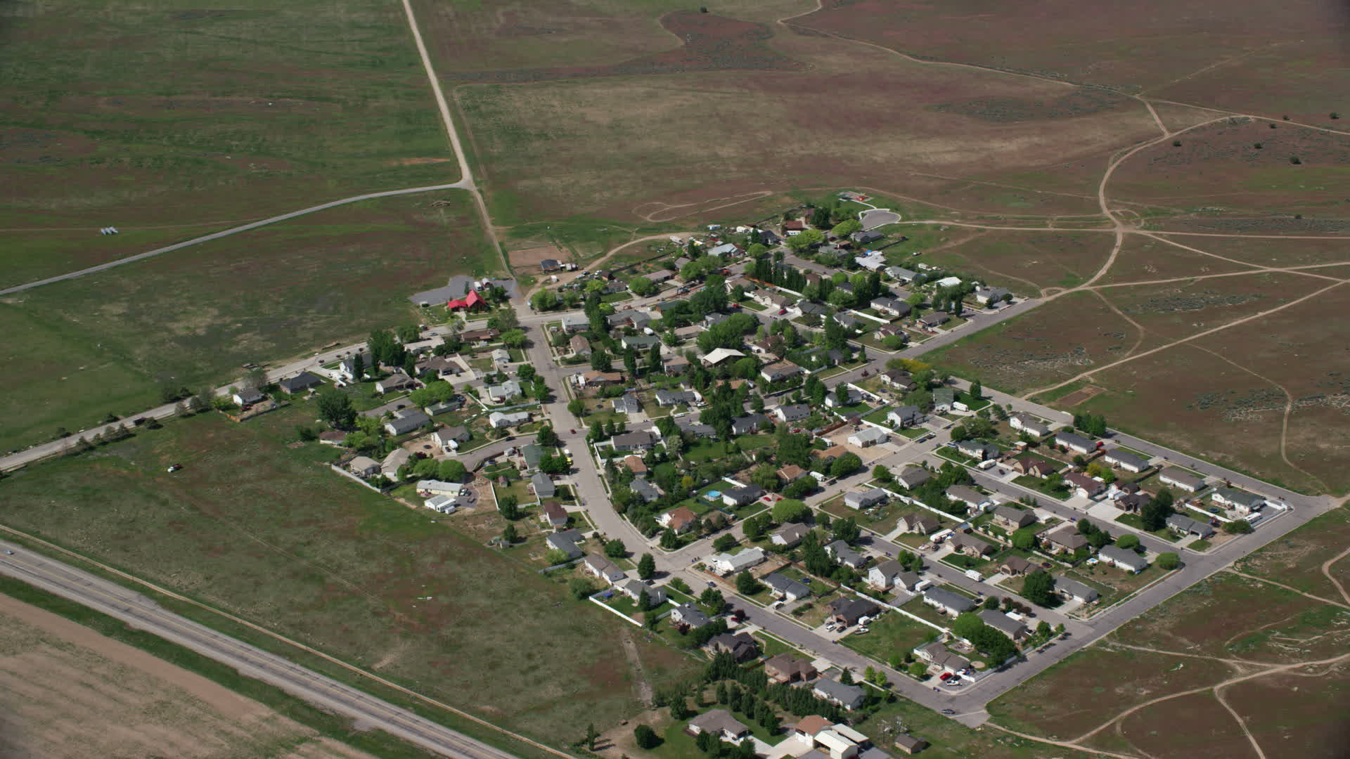 5.5K stock footage aerial video of flying by small rural neighborhood