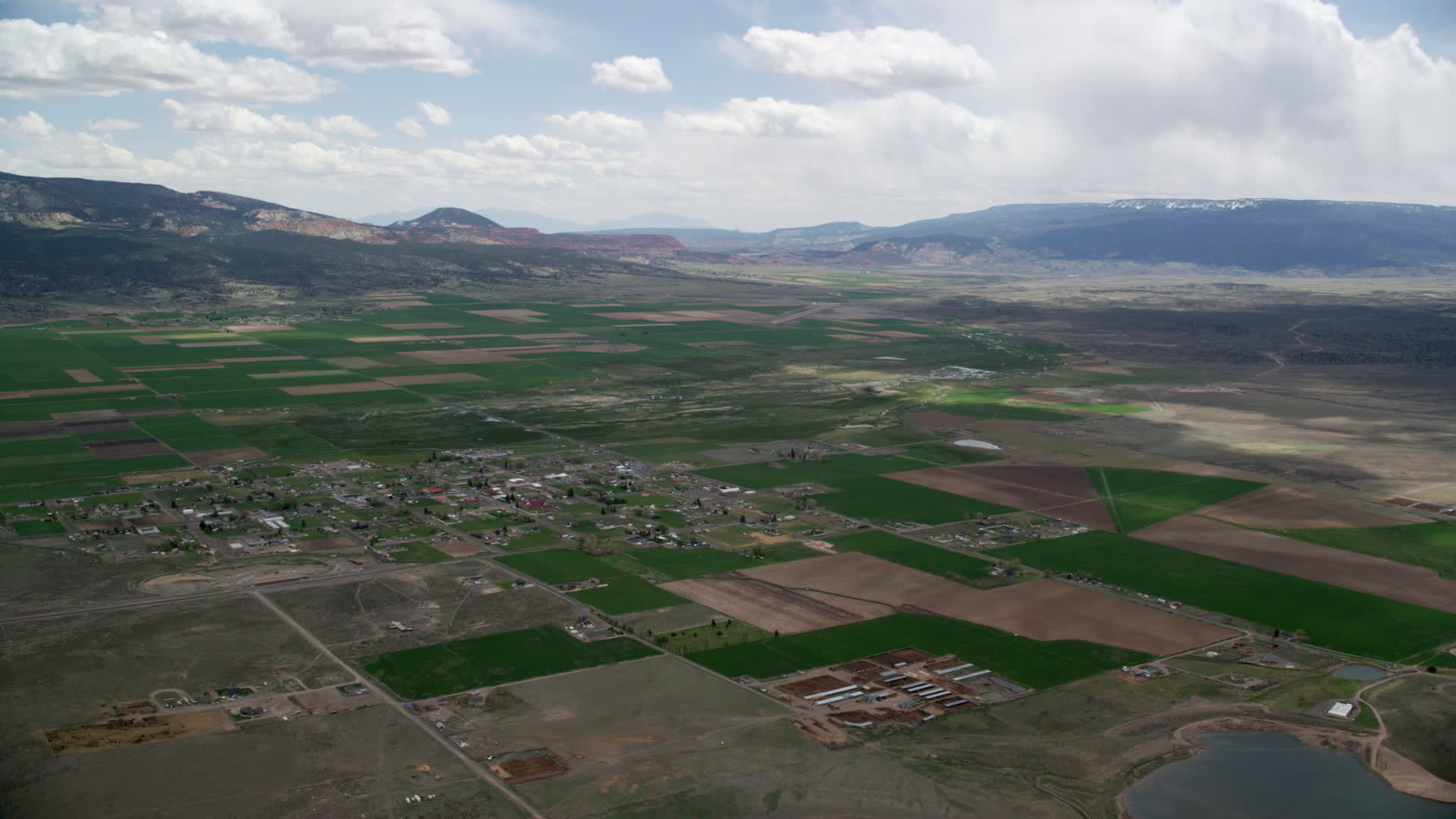 5.5K stock footage aerial video of an approach to a small rural town