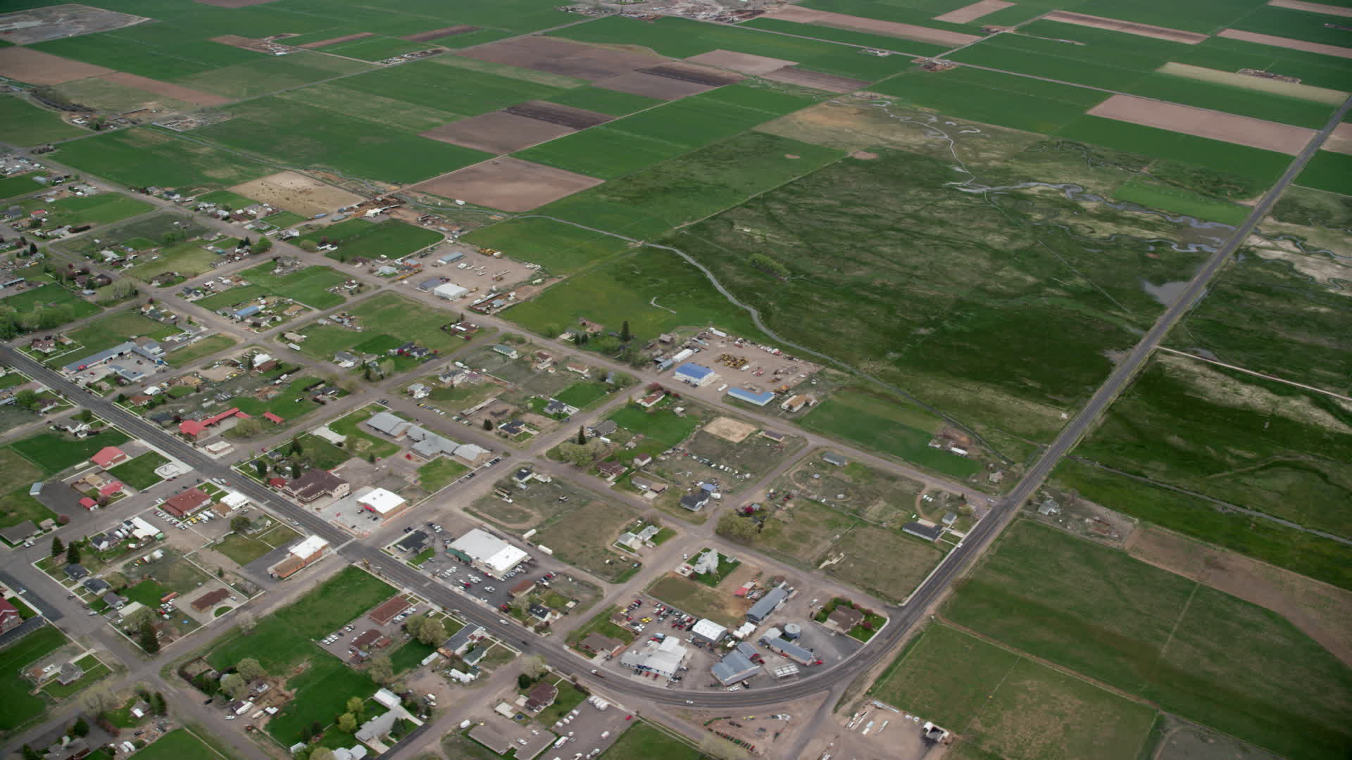 5.5K stock footage aerial video of circling a small rural town and farmland, Loa, Utah Aerial