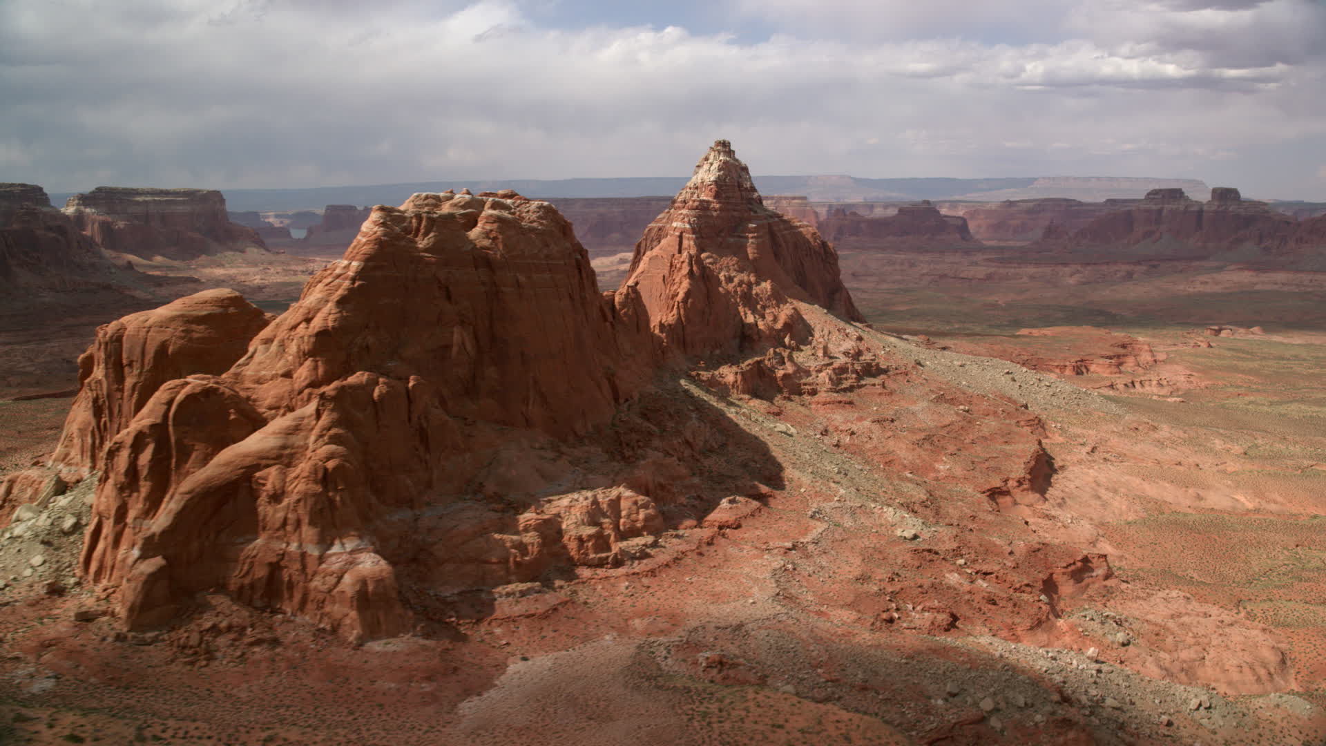 5.5K stock footage aerial video of flying by buttes in the desert
