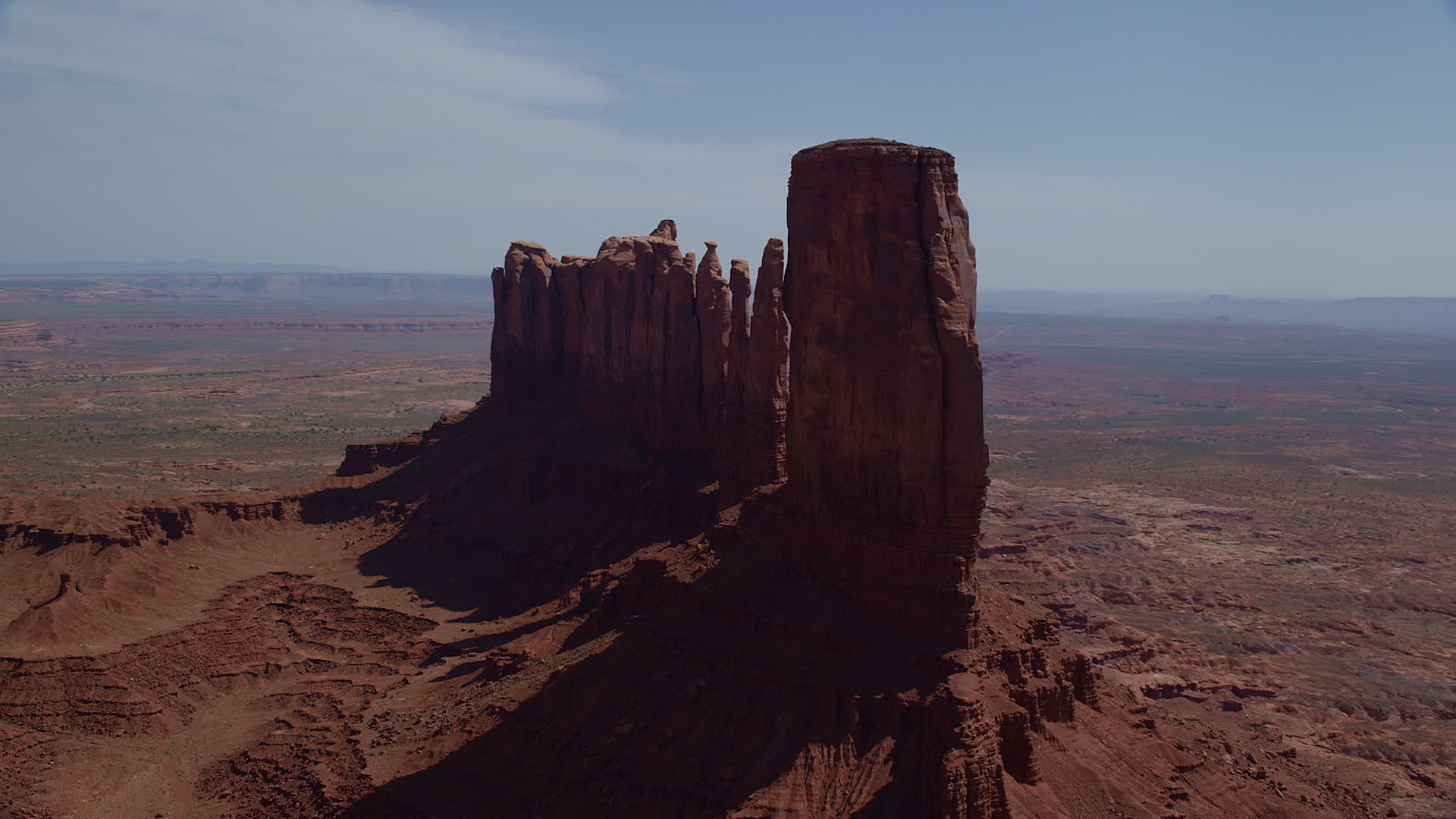 5.5K stock footage aerial video of flying by tall desert buttes in