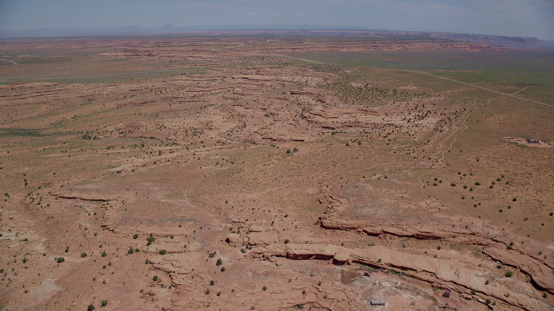 5.5K stock footage aerial video of flying over open desert just north