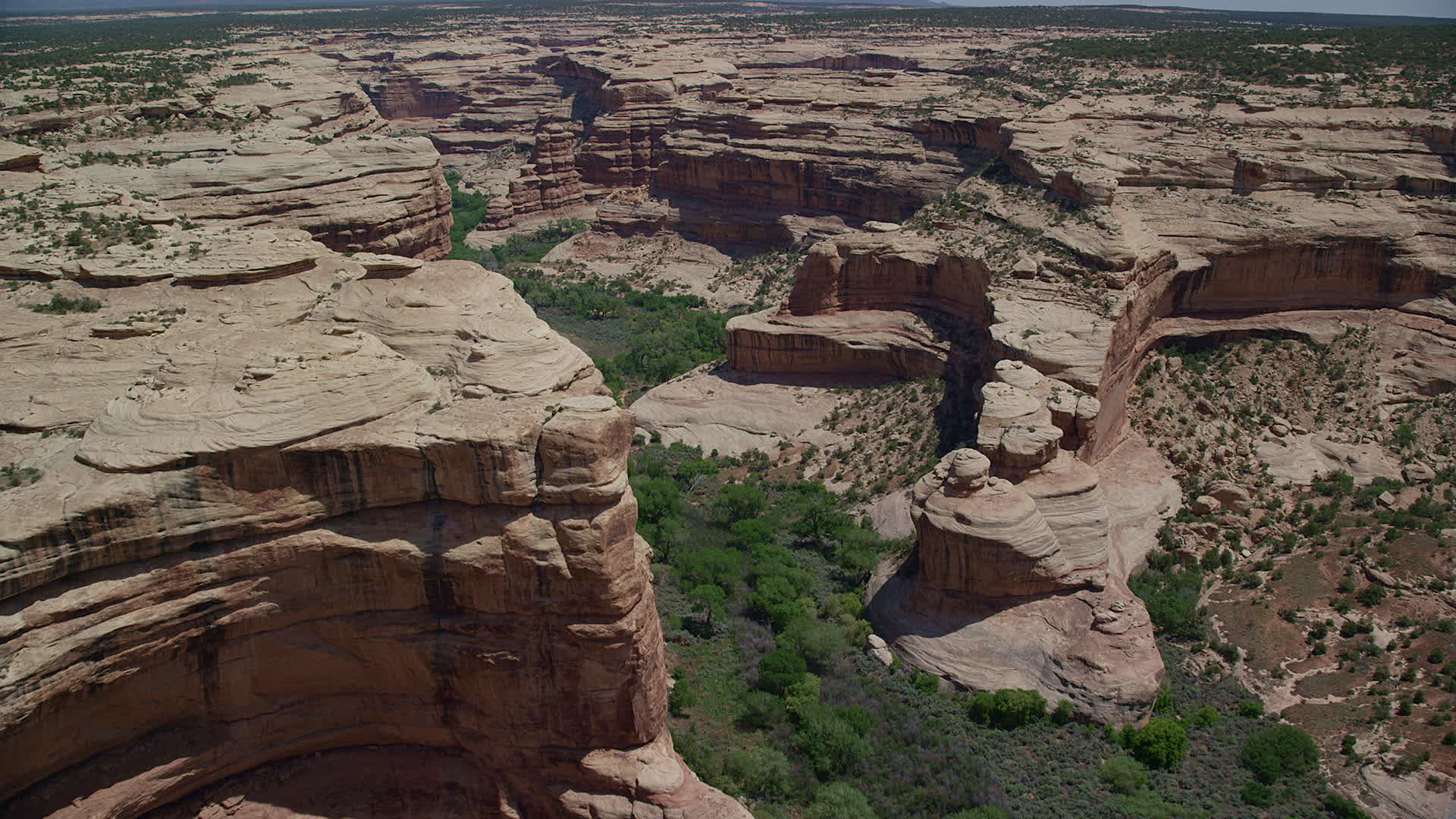 5.5K stock footage aerial video of flying over Grand Gulch canyon